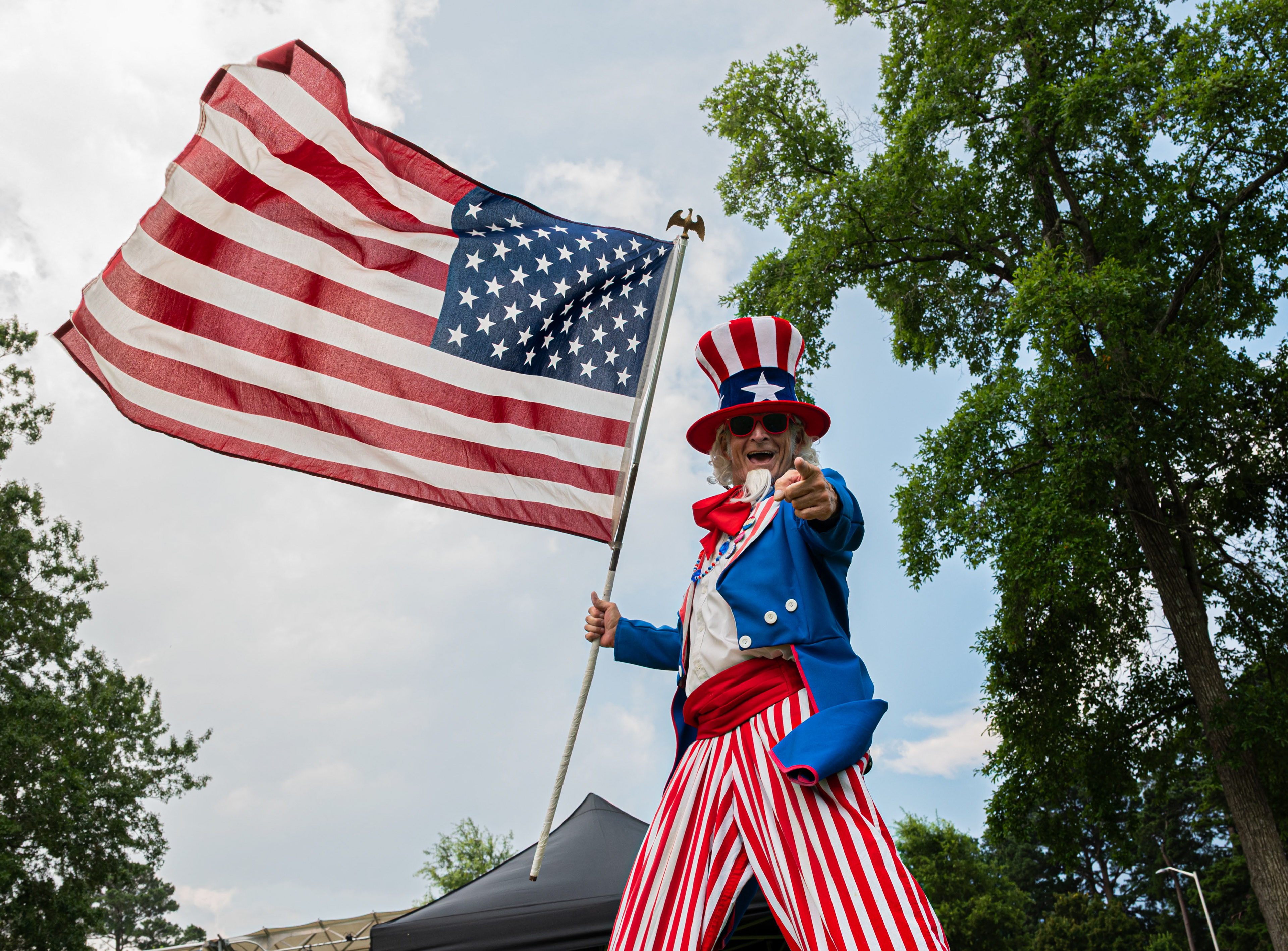 An actor playing as Uncle Sam greets attendees during the annual Independence Day Celebration at Seymour Johnson Air Force Base, North Carolina, June 27, 2025. The event brought together service members, families and the local community to celebrate the nation’s 249th birthday.