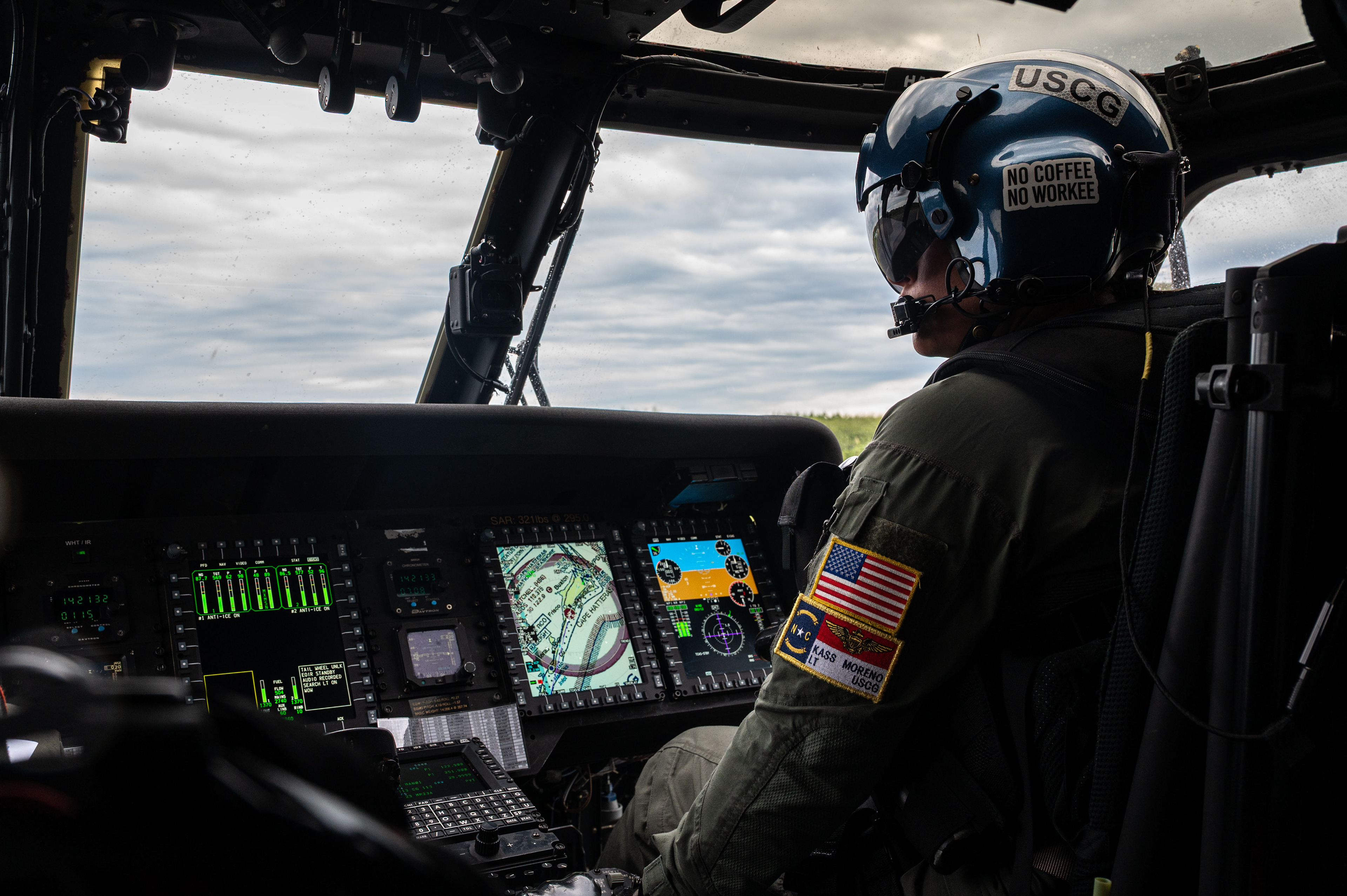 A U.S. Coast Guard pilot assigned to Air Station Elizabeth City, copilots an MH-60T Jayhawk helicopter during a search-and-rescue exercise over Cape Hatteras, North Carolina, Aug. 28, 2025. The flight crew practiced navigation and coordination while supporting recovery operations. 
