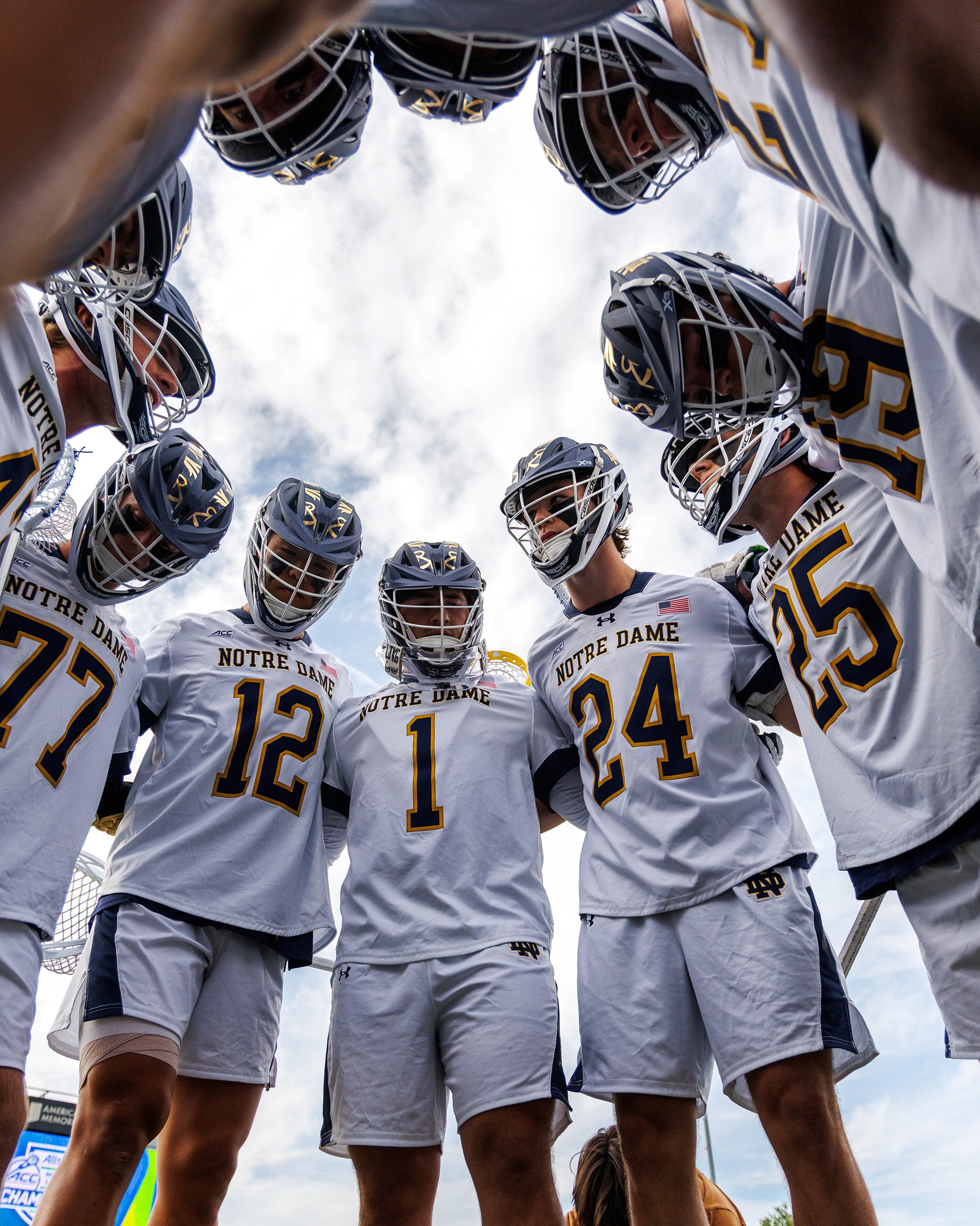 Notre Dame Fighting Irish lacrosse players huddle before their semifinal matchup against the Virginia Cavaliers during the ACC Men's Lacrosse Championship at American Legion Memorial Stadium on May 1, 2026.  (Photo by Miles Lineberger / The ACC)