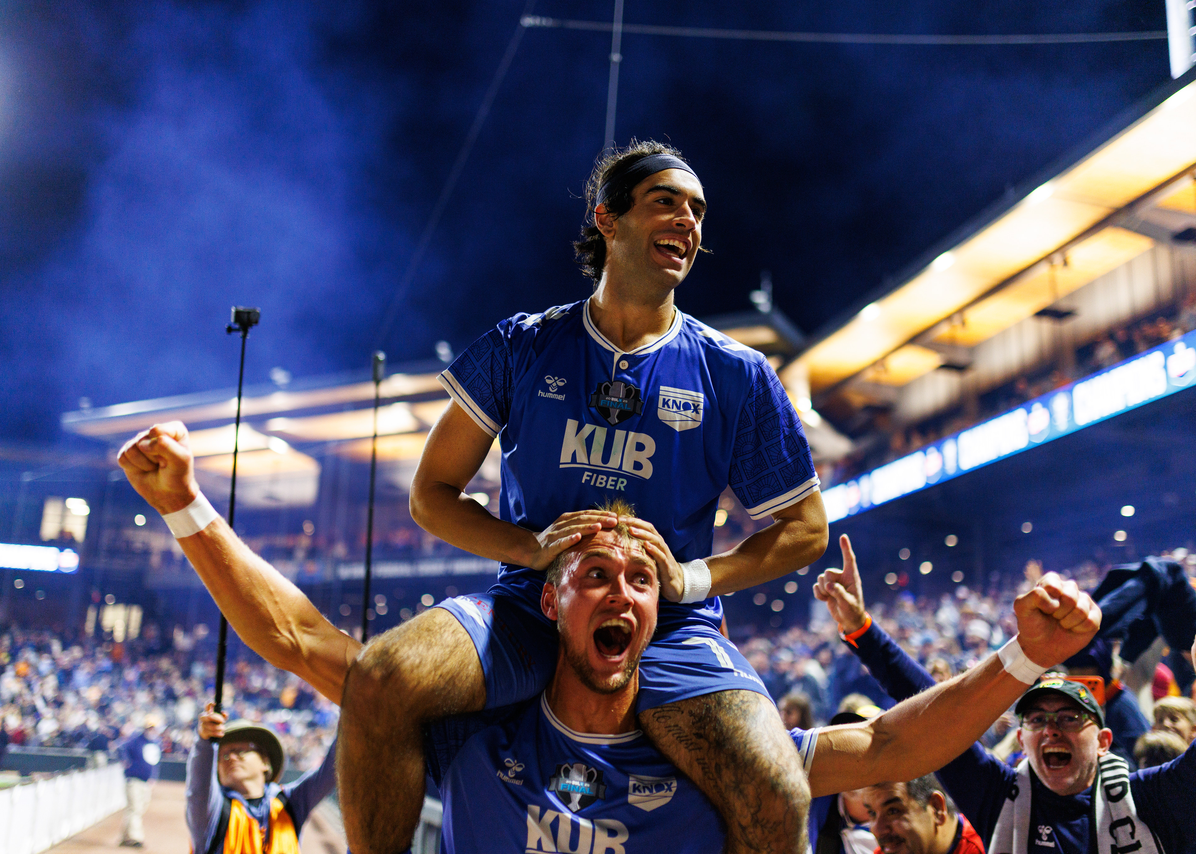 Nico Rosamilia and Jordan Skelton of One Knoxville SC celebrate after defeating Spokane Velocity FC 2-0 to win the USL League One Championship at Covenant Health Park in Knoxville, Tennessee. (Photo by Miles Lineberger for One Knoxville SC)