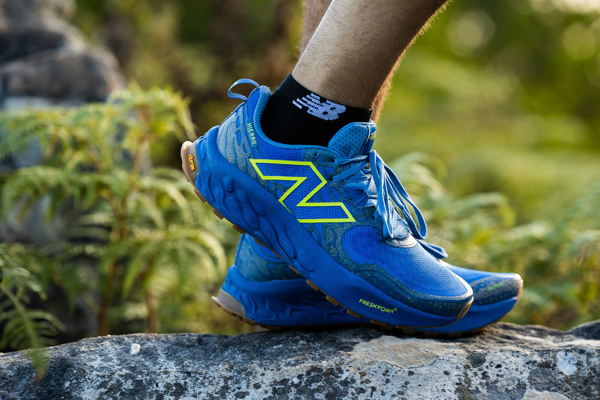 A close up of a trail runner in Cape Town wearing New Balance Fresh Foam X Hierro V8 trail shoes photographed by Casey Crafford