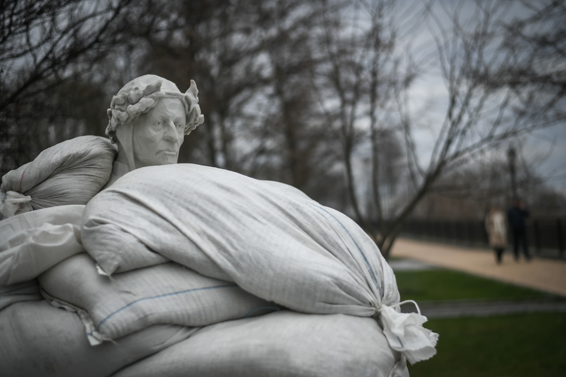 Kyiv, Ukraine - April 11, 2022: Dante Alighieri statue covered with sandbags to protect it against shellings during the Russian invasion in Kyiv,