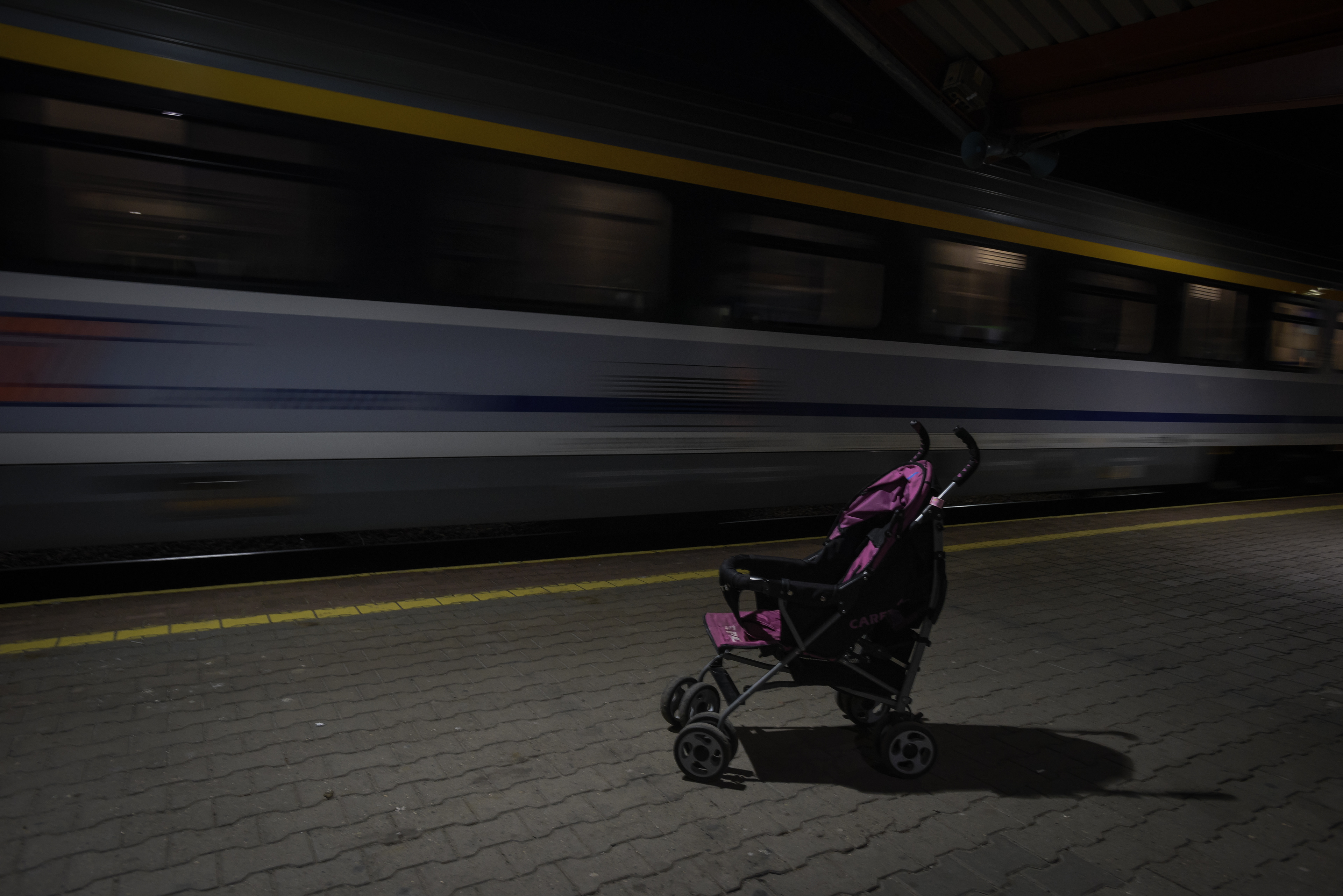 Przemysl, Poland - March 4, 2022: a stroller is seen abandoned at Przemysv train station as refugees from Ukraine flee the country after Russia launched a full-scale military operation in the country
