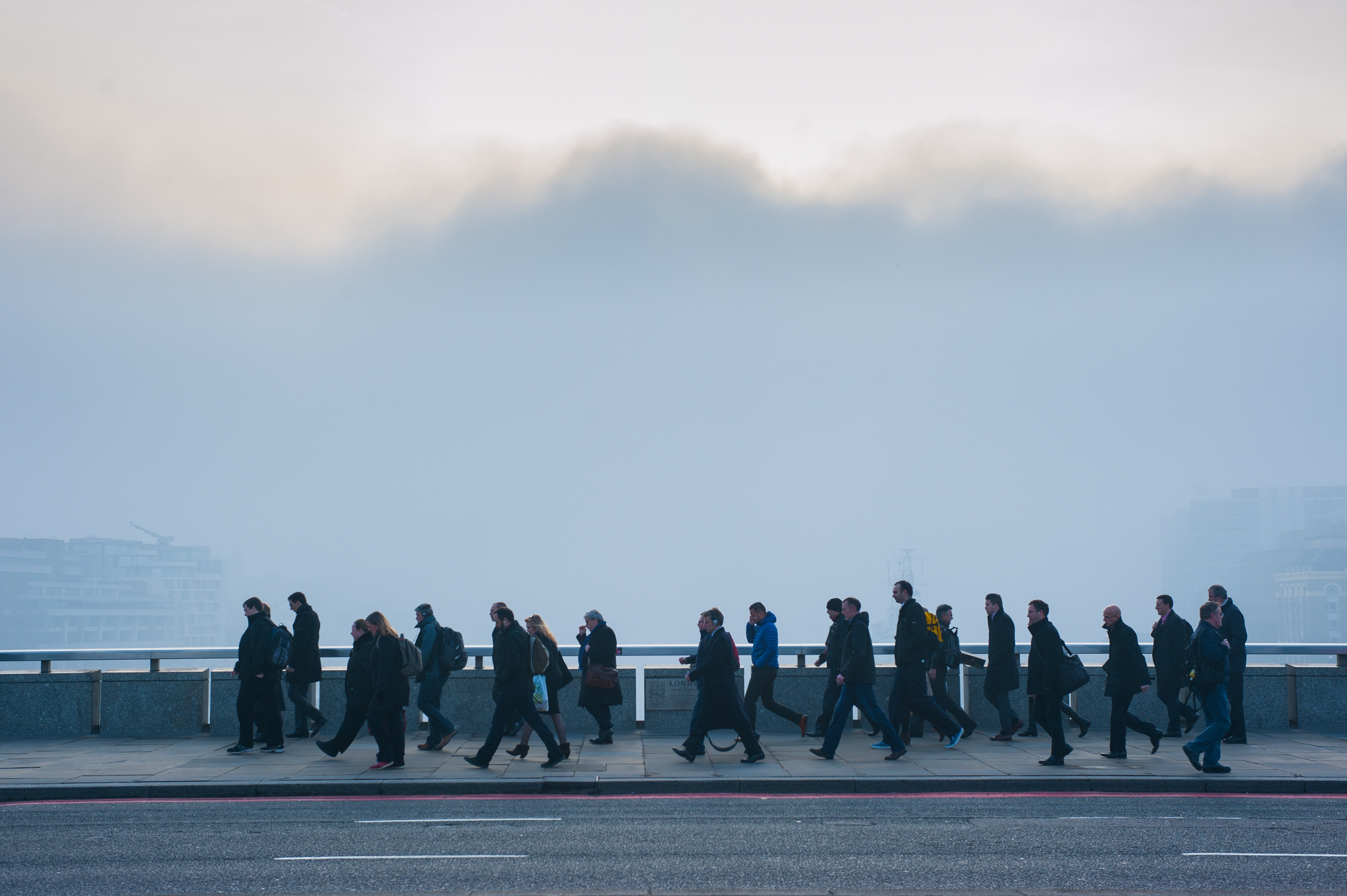 London, UK - 13 March 2014: Commuters cross London Bridge as London wakes up under heavy fog Fotografo Milano - Photographer Milan