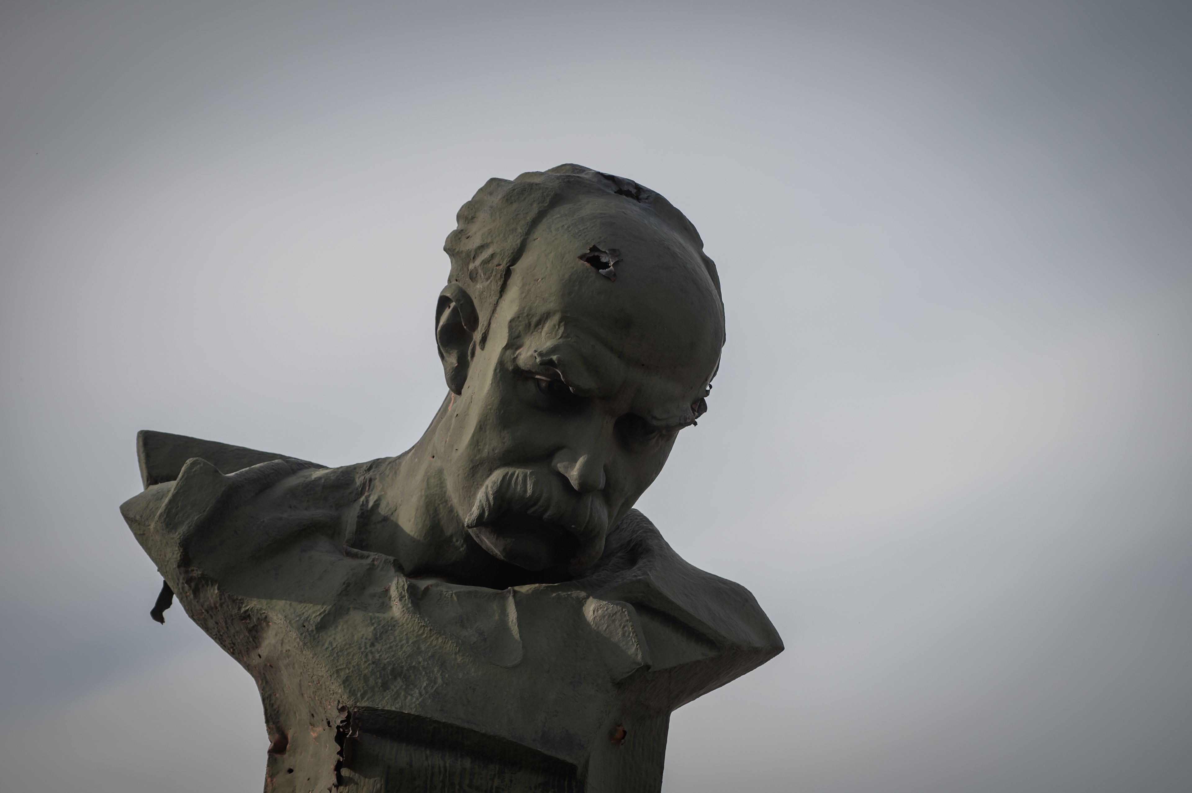 Borodyanka, near Kyiv, Ukraine - April 15, 2022: A statue of poet Taras Schevchenko is seen damaged by a bullet in the head in central Borodyanka