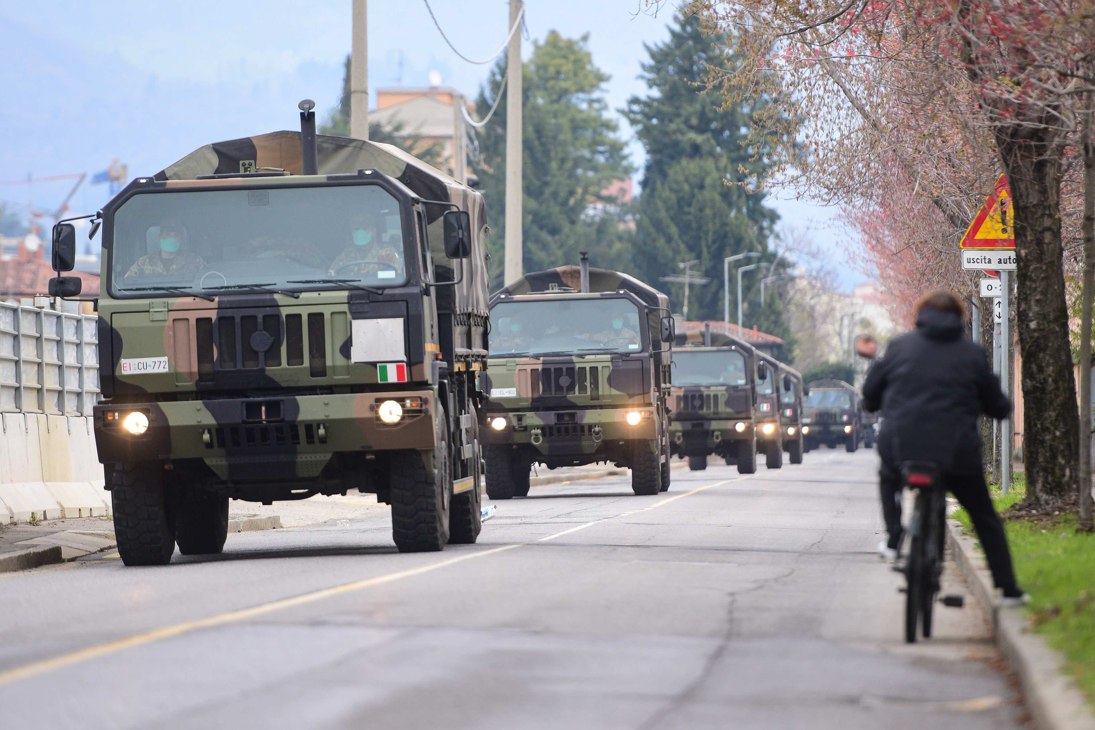 Military trucks transport coffins from the Monumentale Cemetery in Bergamo, Italy on March 26, 2020 