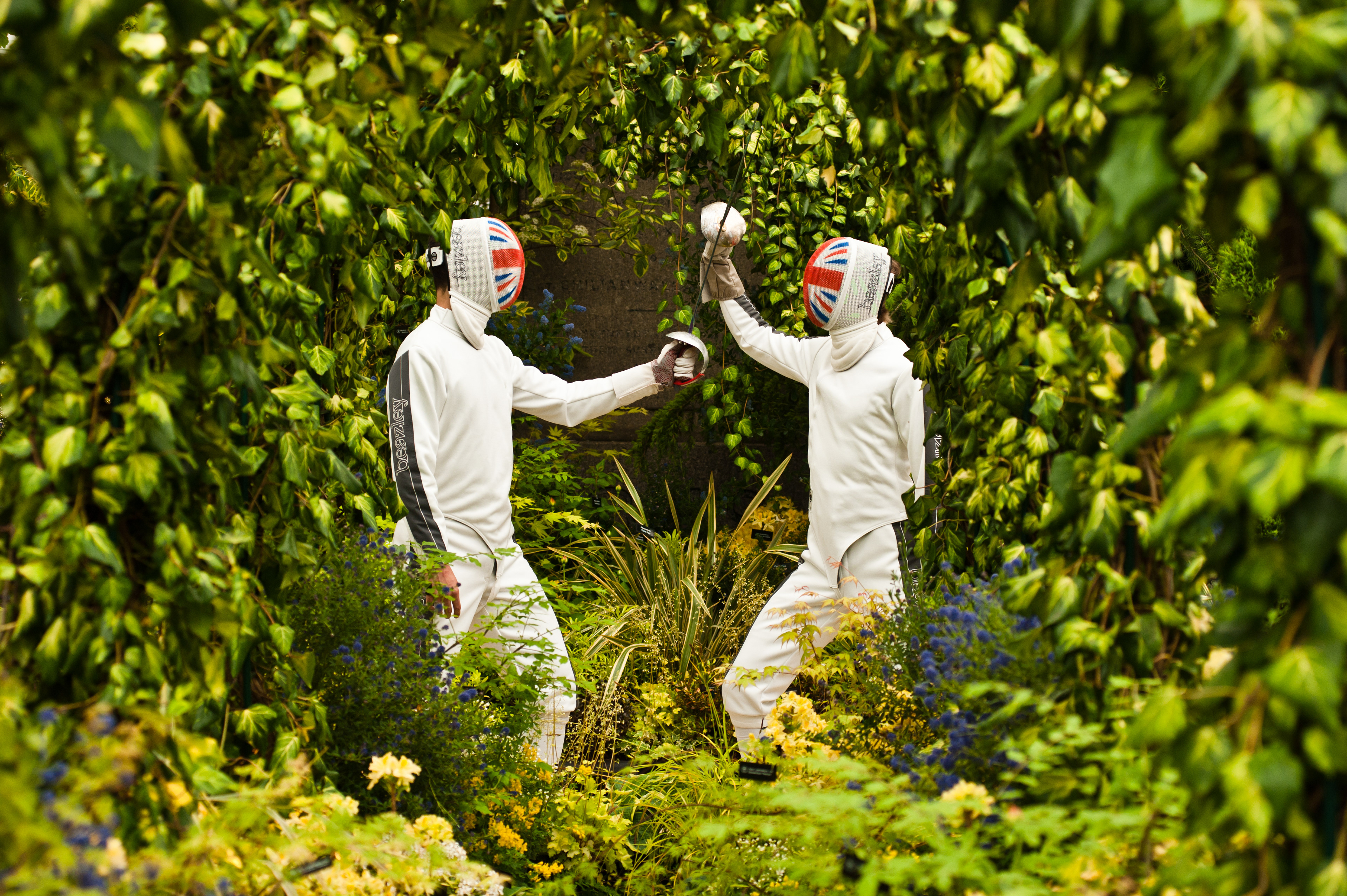LONDON, UK - 21 May 2012: fencers from the British Fencing Team clash swords at the 'Hillier Nurseries & Garden Centres' stand at the RHS Chelsea Flower Show 2012. Fotografo Milano - Photographer Milan