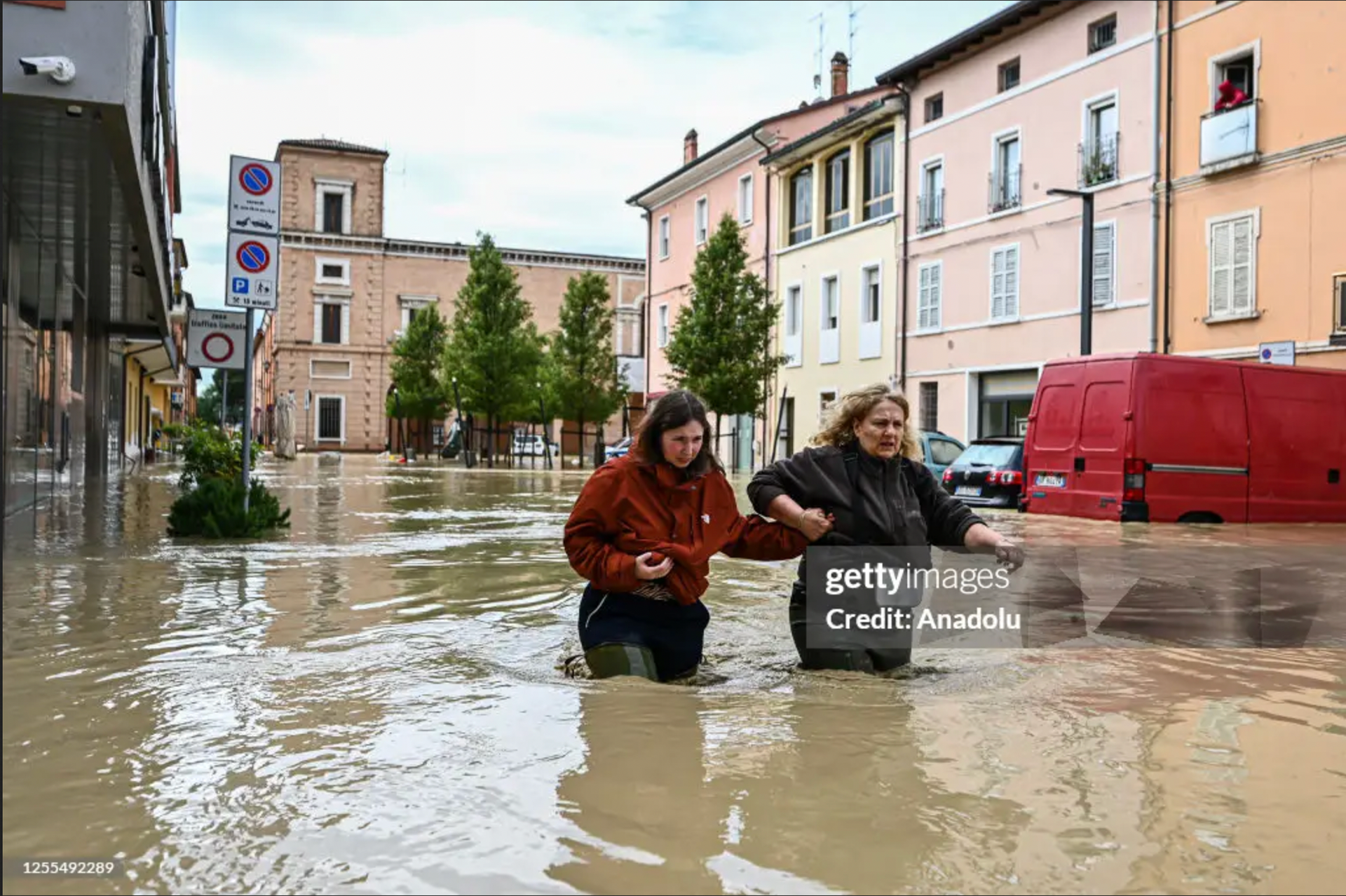 CASTEL BOLOGNESE, ITALY - MAY 17: Pedestrians walk in a flooded street in Castel Bolognese, near Imola, Italy on May 17, 2023. At least three people were killed and thousands of others displaced after torrential rains poured over the northern Italian region of Emilia Romagna, local authorities said on Wednesday. - Fotografo a Milano - Photographer Milan -