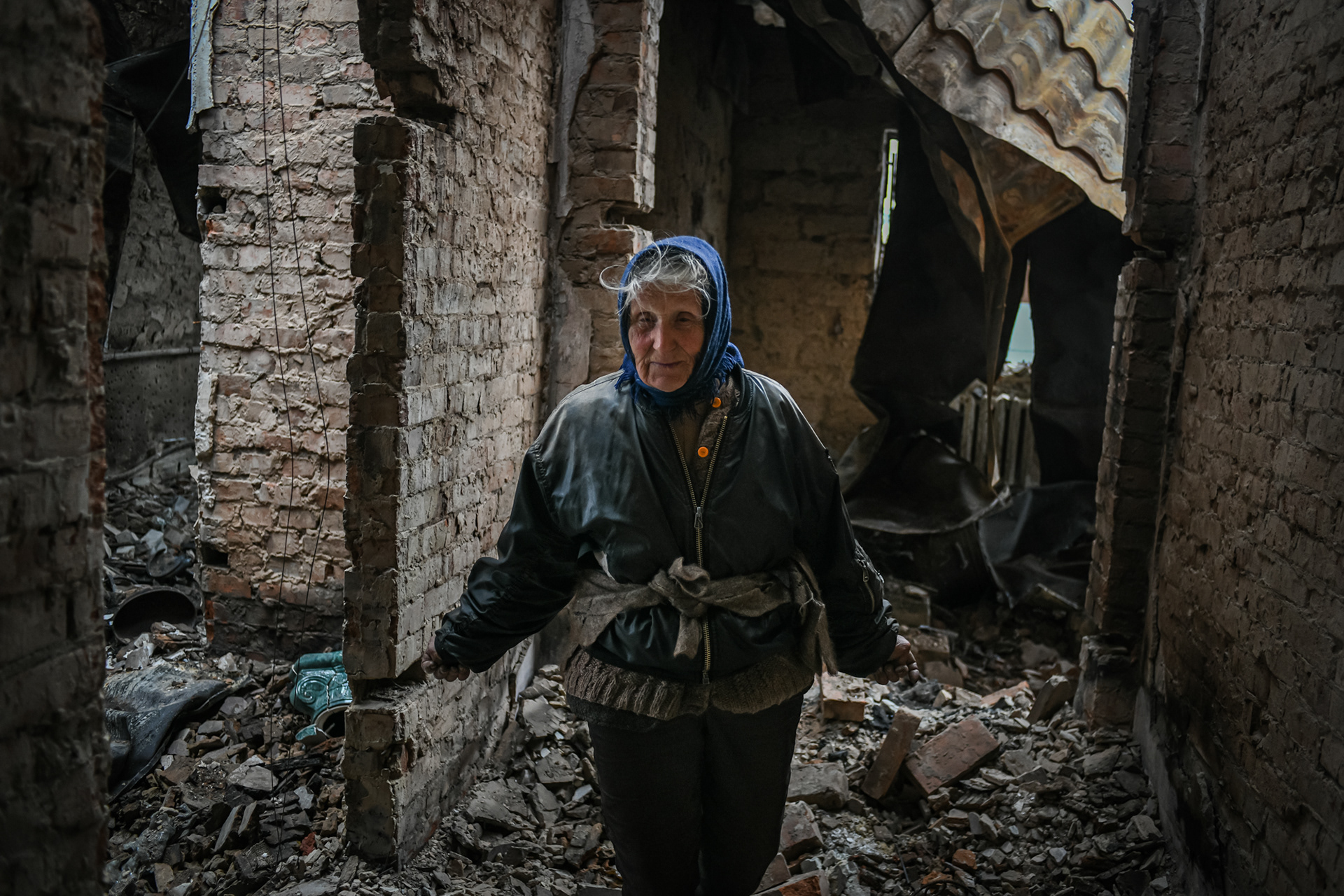 Ganna Petrivna, 76, gestures as she speaks in her house totally destroyed by aviation shellings in a residential area of Chernihiv, Ukraine during the Russian invasion on April 16, 2022.