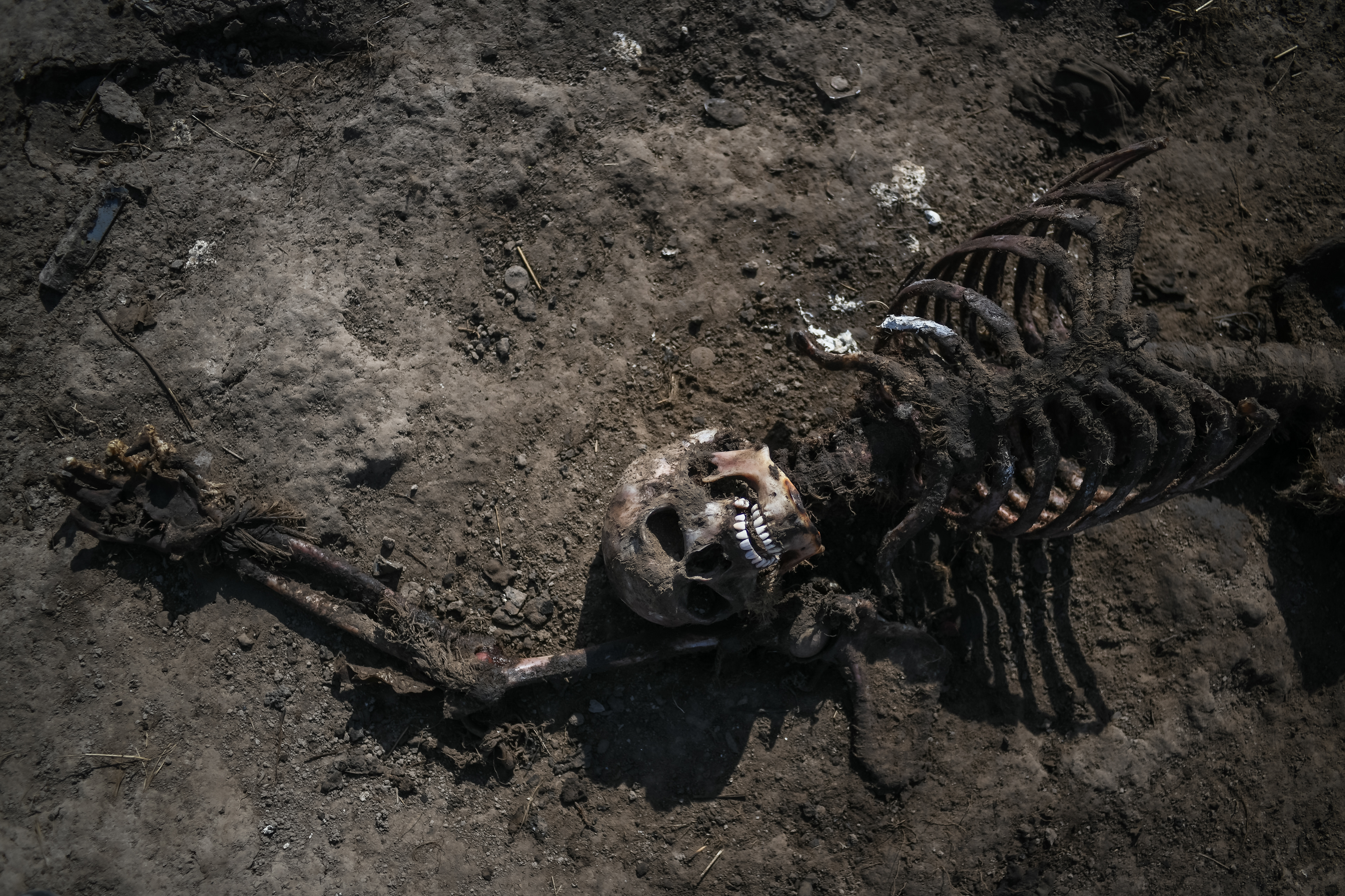 Makariv, near Kyiv, Ukraine - April 15, 2022: a victim of a Russian helicopter crash is seen in a field near Kyiv