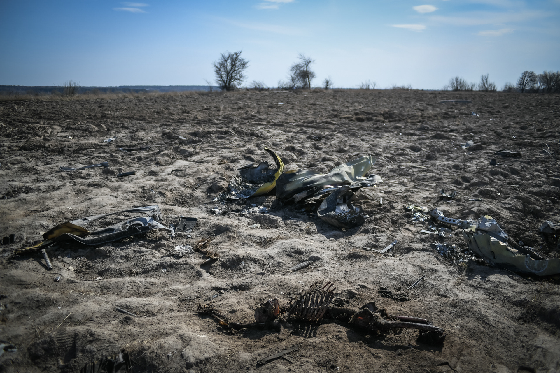 Makariv, near Kyiv, Ukraine - April 15, 2022: the wreckage of a Russian helicopter and three bodies are seen in a field 