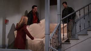 Characters Rachel, Ross, and Chandler trying to get a sofa up a narrow staircase from the TV show Friends.