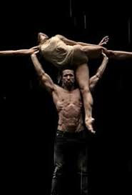 Image of Mac holding up a female dancer from the episode Mac Finds His Pride in It’s Always Sunny in Philadelphia