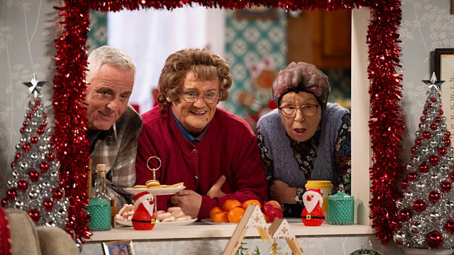 Cast of Mrs Brown surrounded by Christmas Decorations
