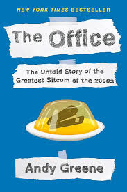 The front cover of the book. The Office - The Untold Story of the Greatest Sitcom of the 2000s by Andy Greene. It has an image of a stapler in jelly