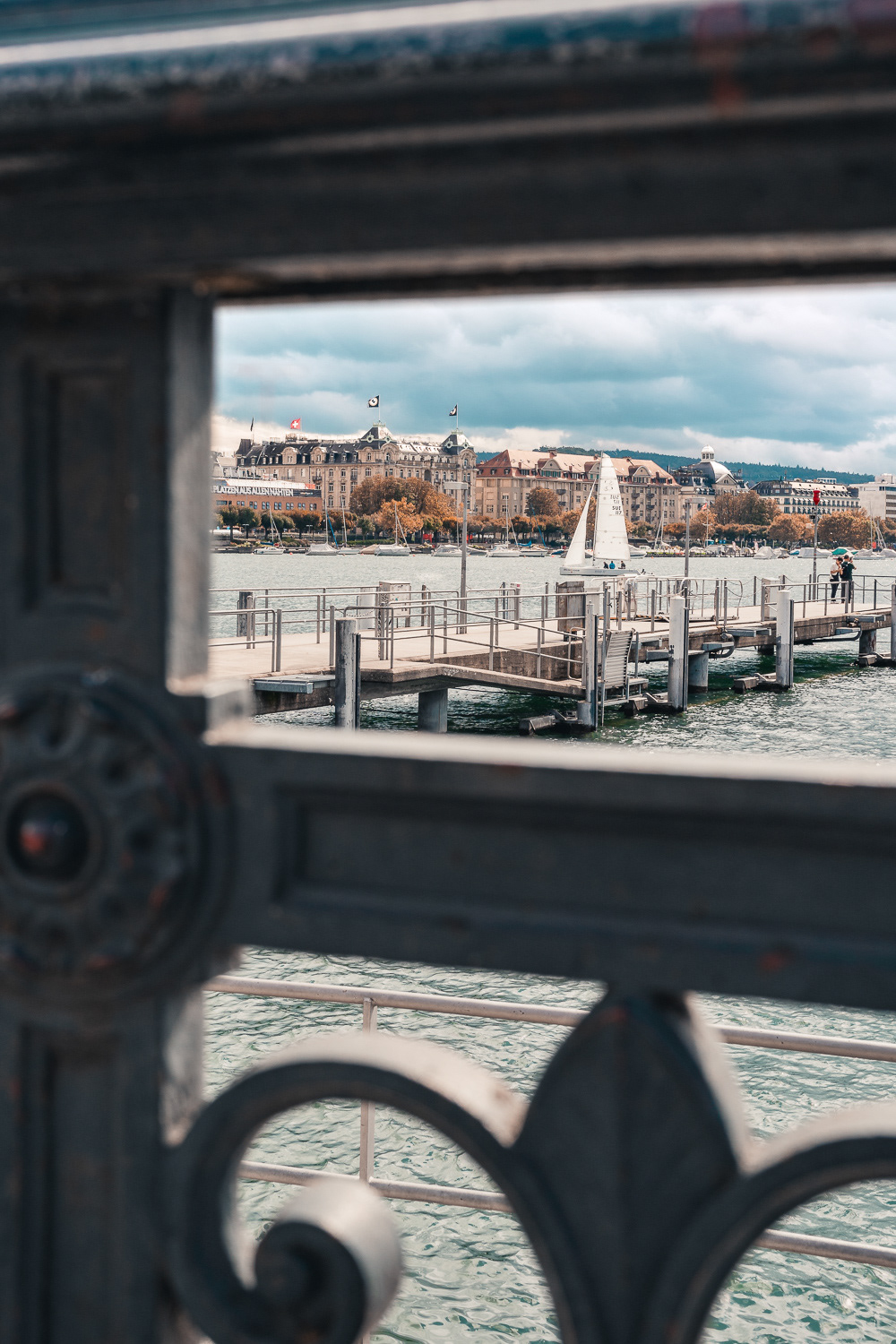 Sailboat on Lake Zurich view from Bürkliplatz in Zurich, Switzerland. Photo by Anson Tang.