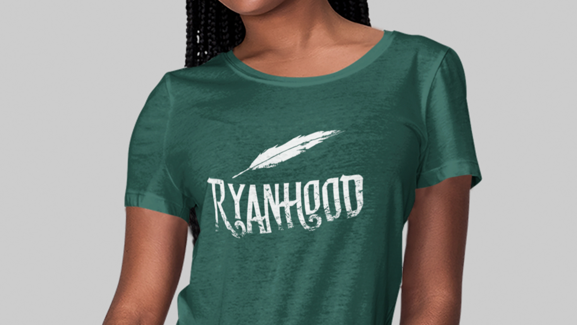 Tucson custom T-shirt design of white feather logo with Disney's "Robin Hood" font on green shirt for folk band Ryanhood
