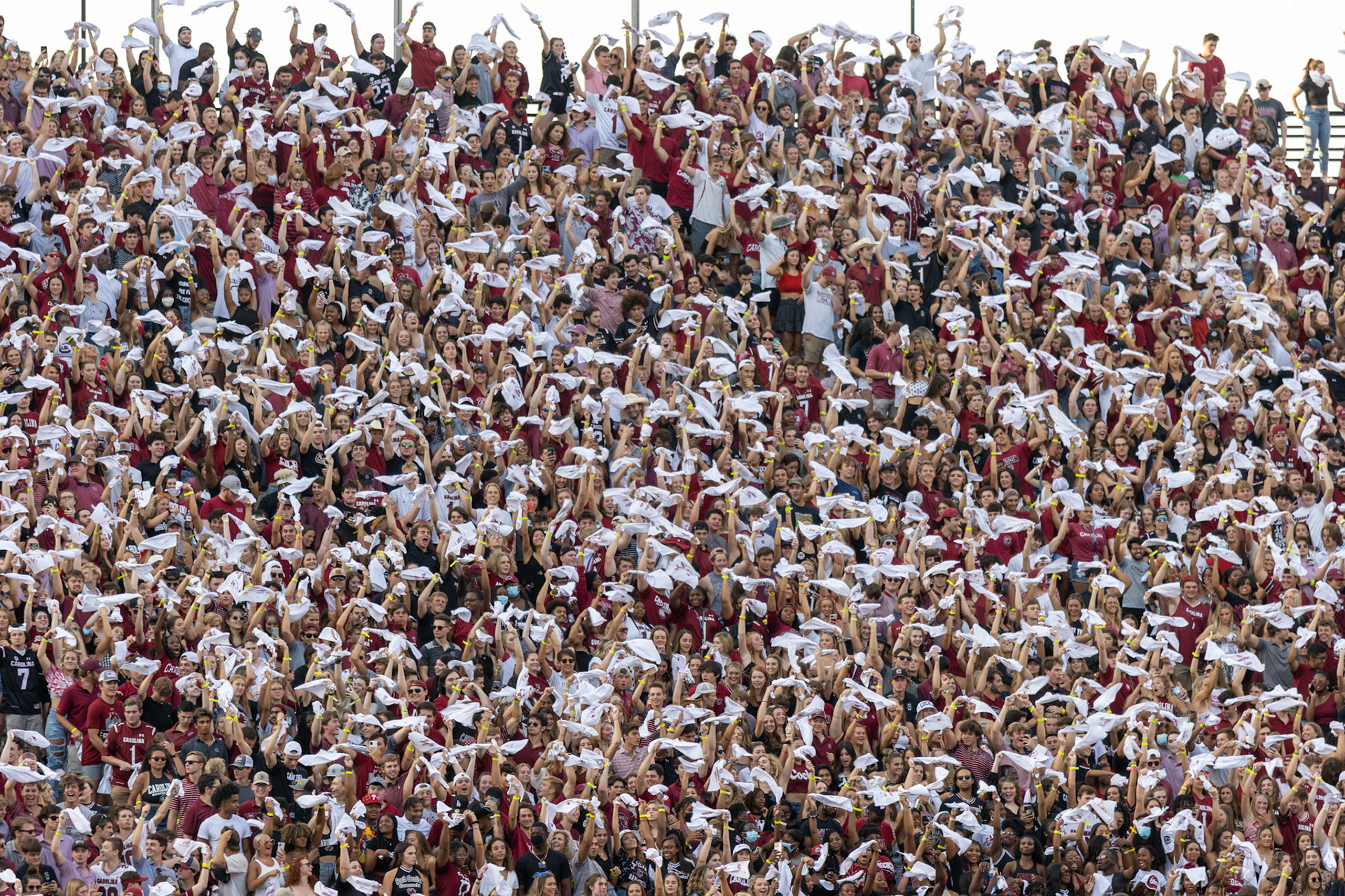 The Sandstorm begins in the student section as rally towels are flailed around.