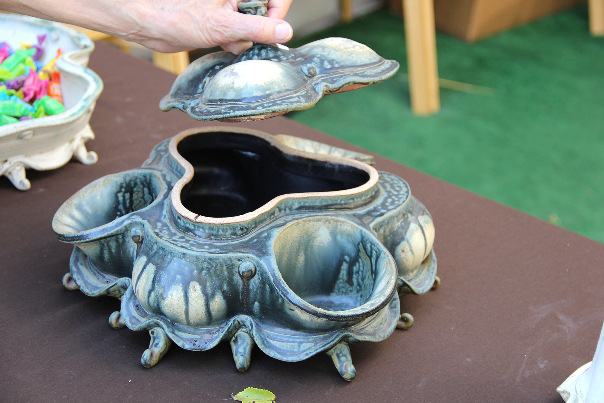 Houston artist, Roy Hanscom, constructs ornate serving dishes by throwing multiples on a wheel and attaching them together.