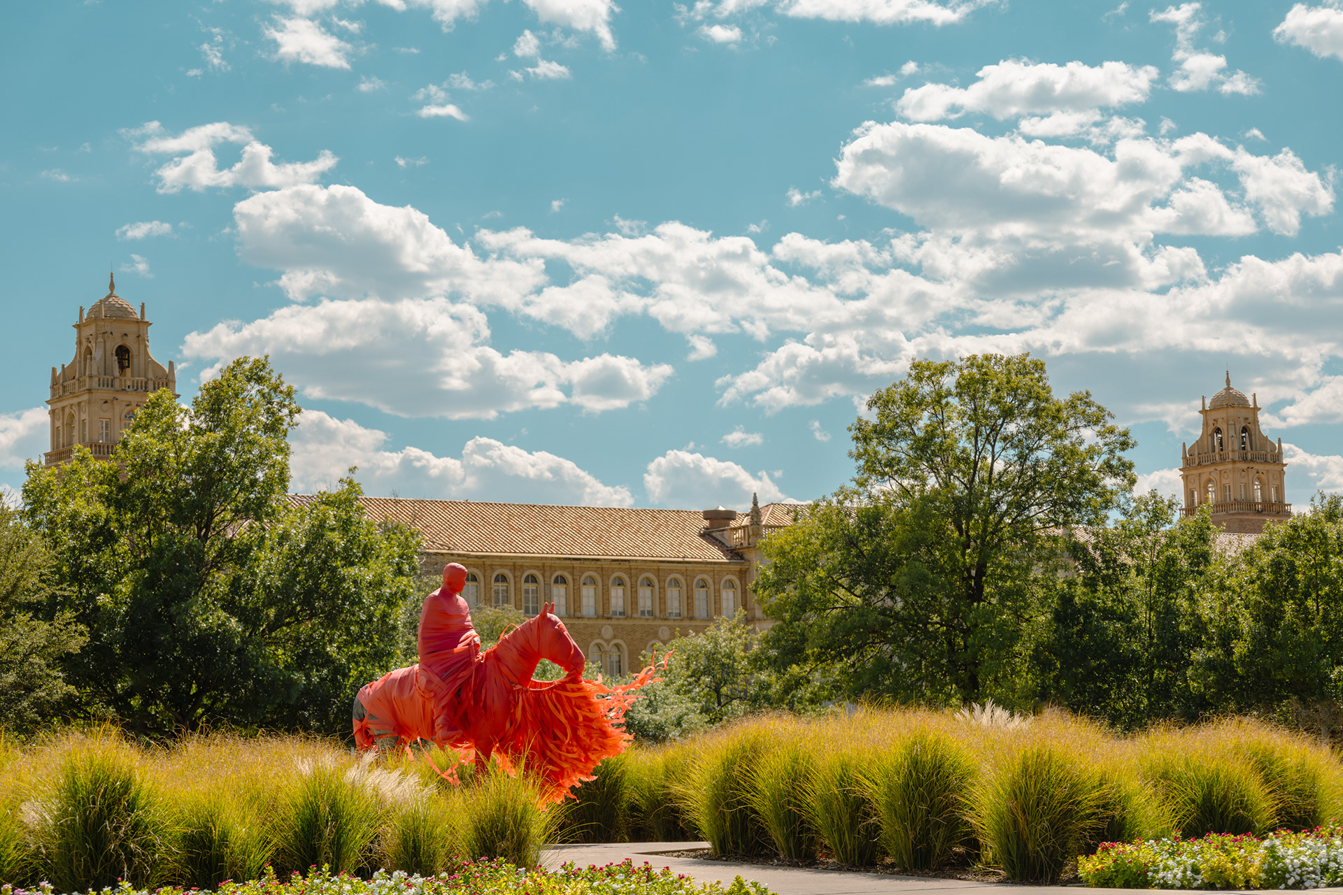 Electra Waggoner Biggs' "Riding into the Sunset" wrapped for gameday in front of the Texas Tech Administration Building