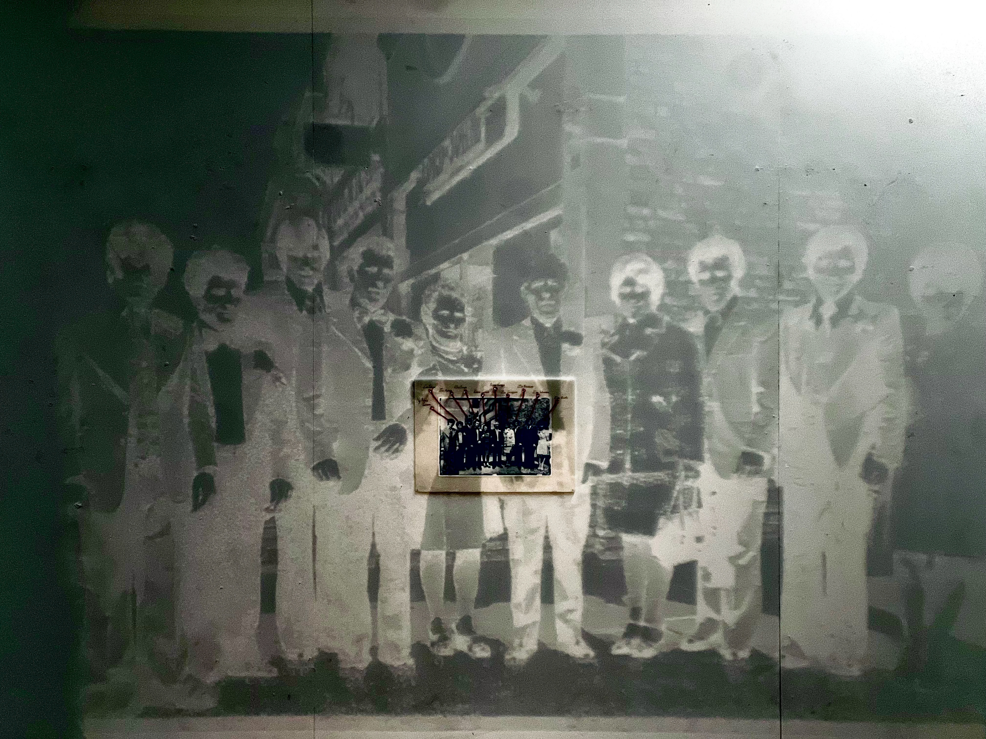 Castiglione. C 'The Wedding' (2024), Cyanotype Print on foam, 29.7x42cm. Projection overlay close up darkened.