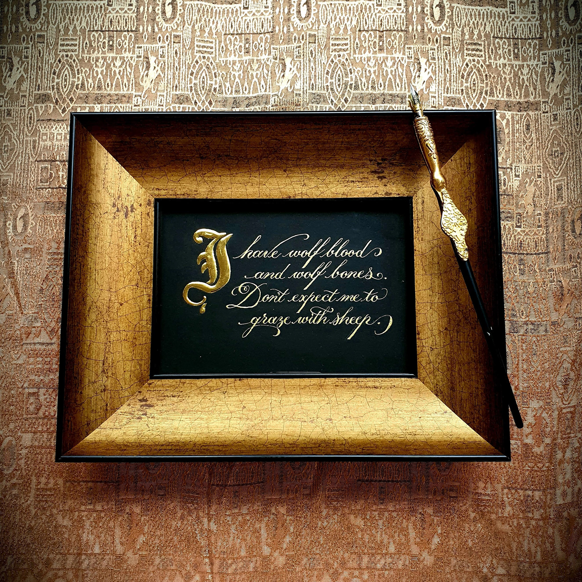 gold ink on black paper, with 24 carat gold gothic capital, framed