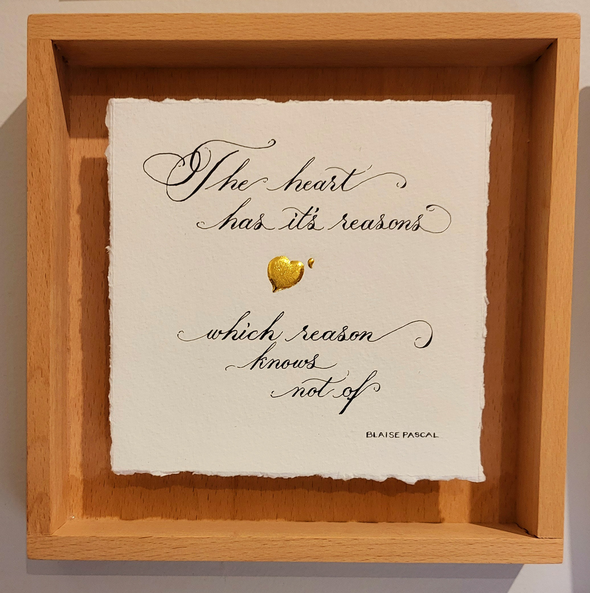 calligraphy in a floating frame, with 24 carat gold heart