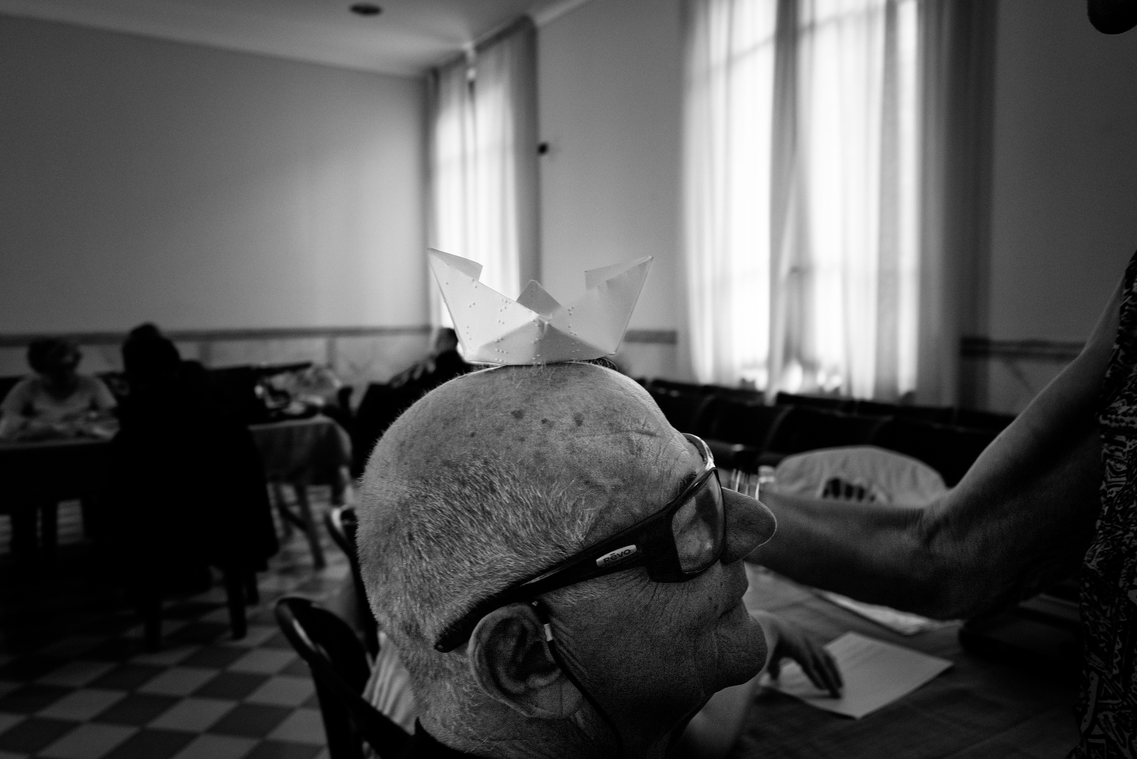 Milano Italy,2023. Union of the Blind of Milan. A paper boat made with a sheet of paper with braille characters from the writing lesson superimposed on it