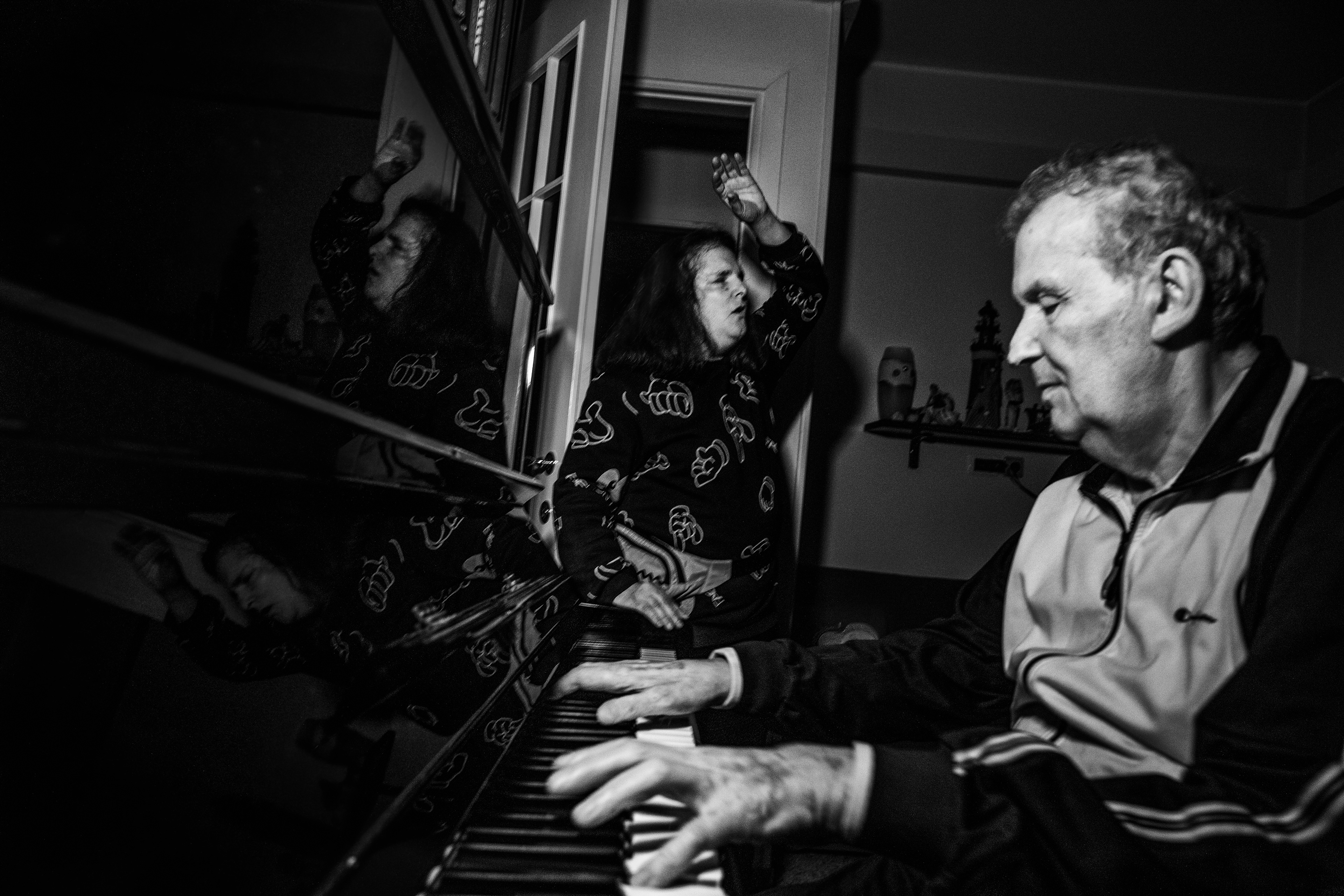Milan Italy 2021, Silvano's house. Manuela, Silvano's partner, accompanies him singing. The two make up a musical duo in perfect harmony.