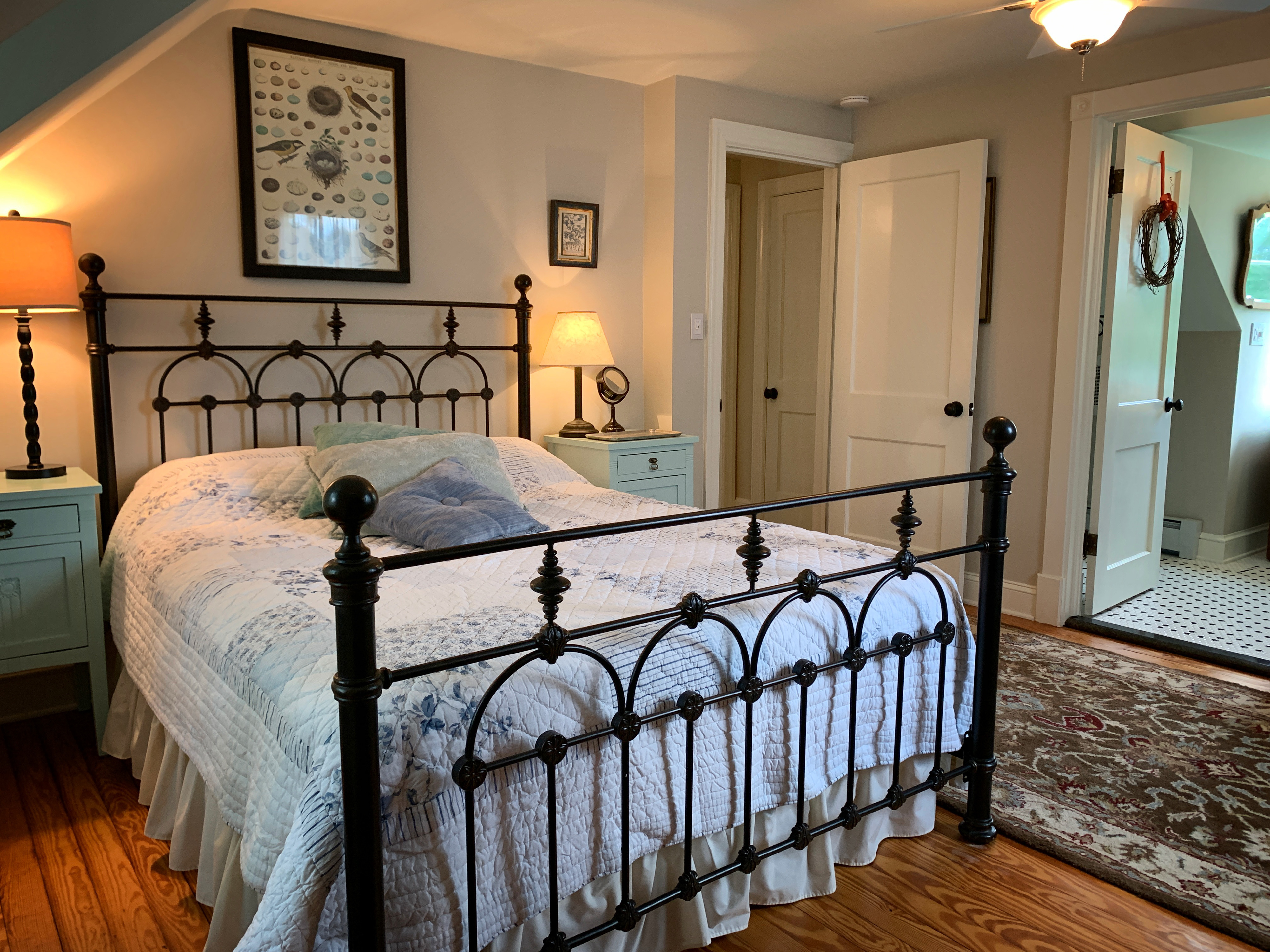 The master bedroom has a queen bed with a luxury Loom and Leaf premium memory foam mattress, and an attached bath.