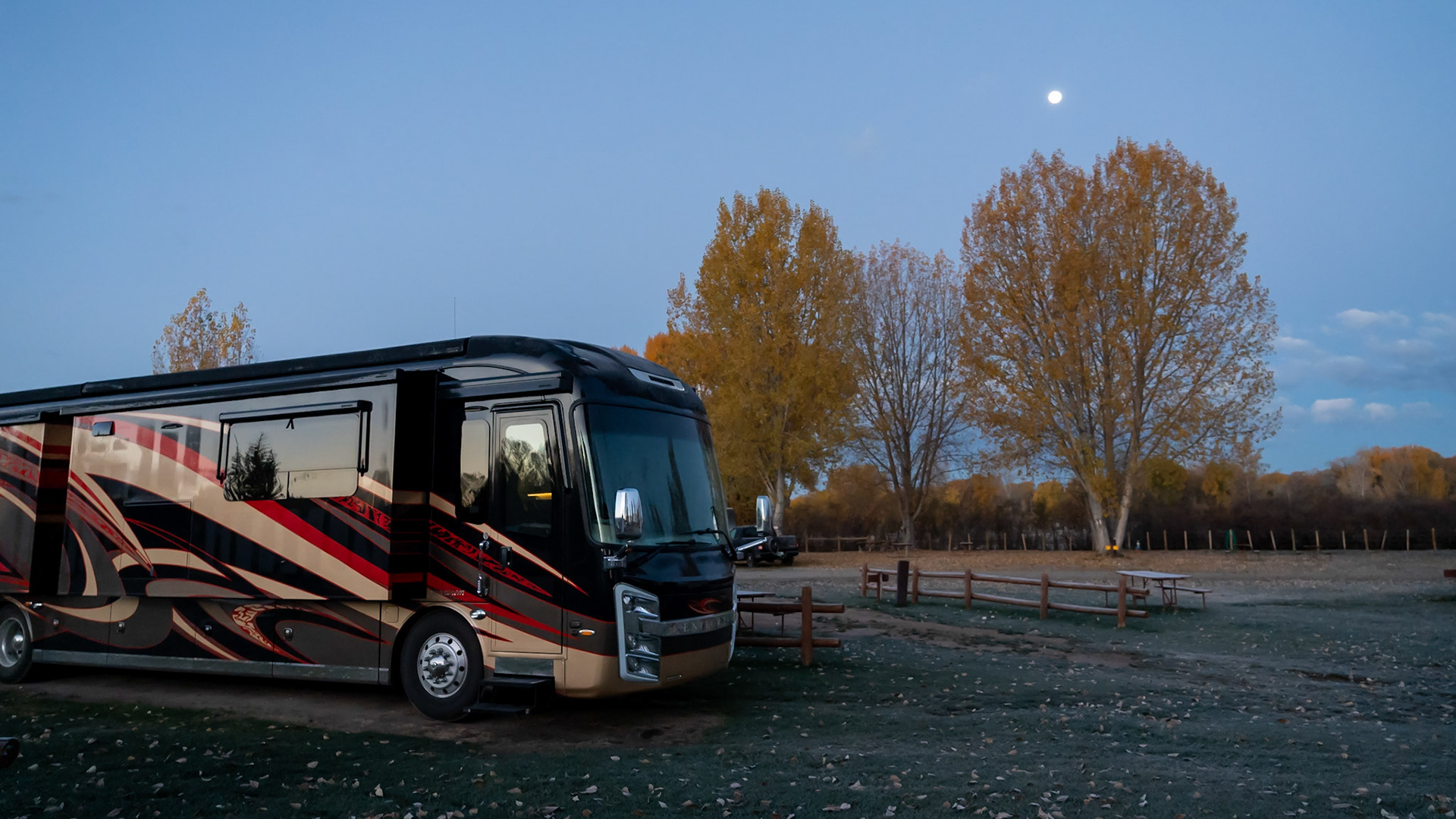 Full moon is setting at dawn in Gunnison