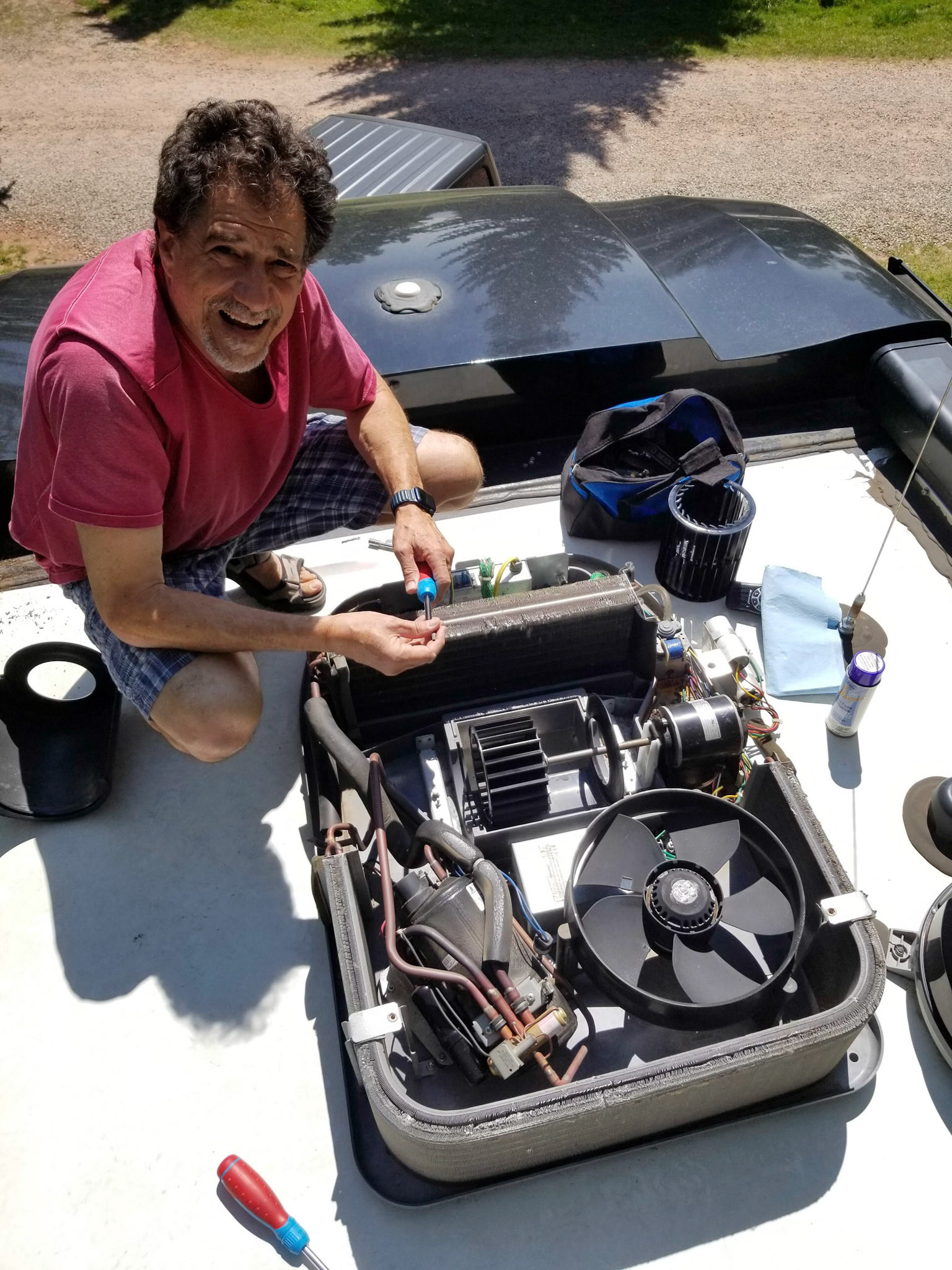 AC repair on the roof of the RV
