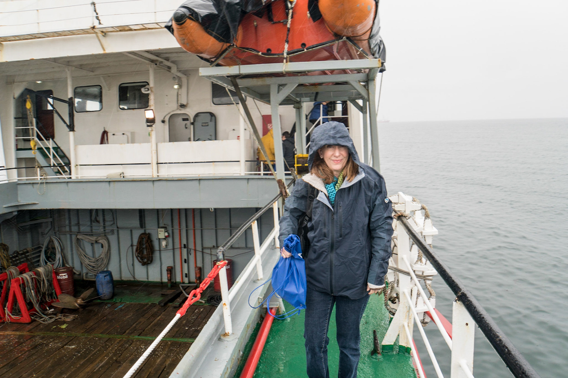 Its cold and wet on the ferry to Magdalena Island in Strait of Magellan
