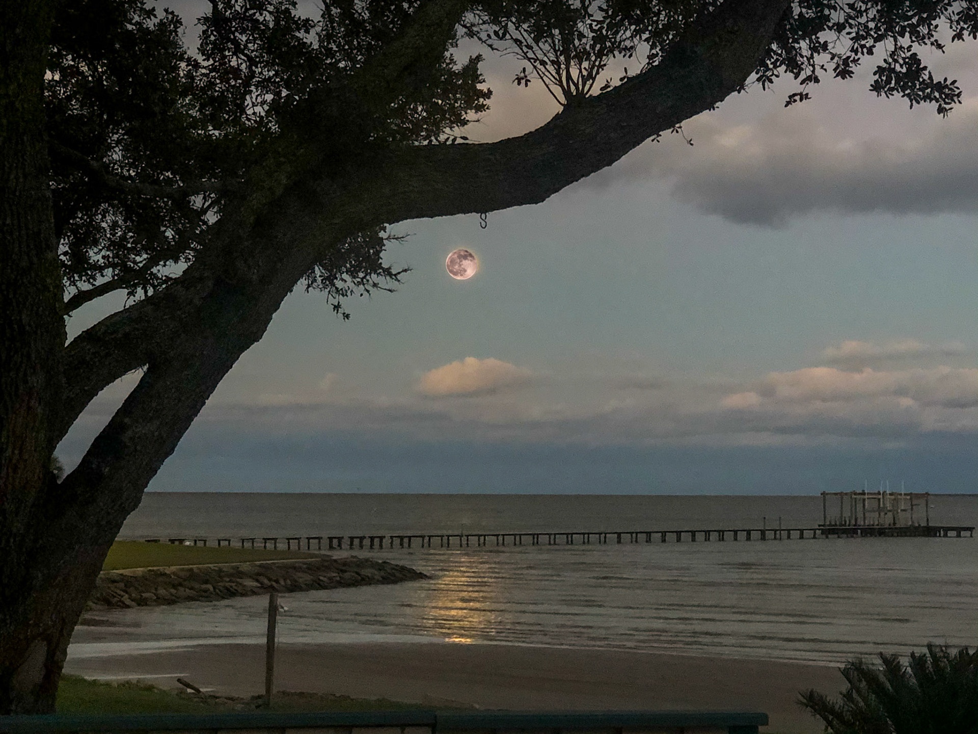 Full moon rising over Galveston Bay