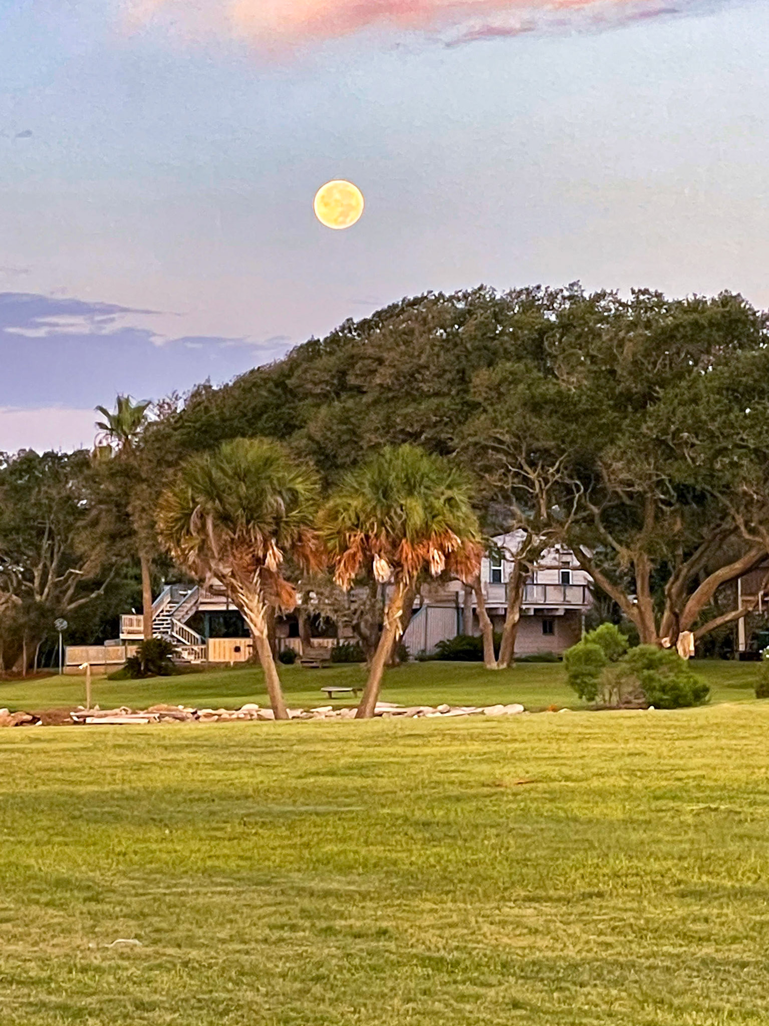 Full moon setting over the Seabrook house