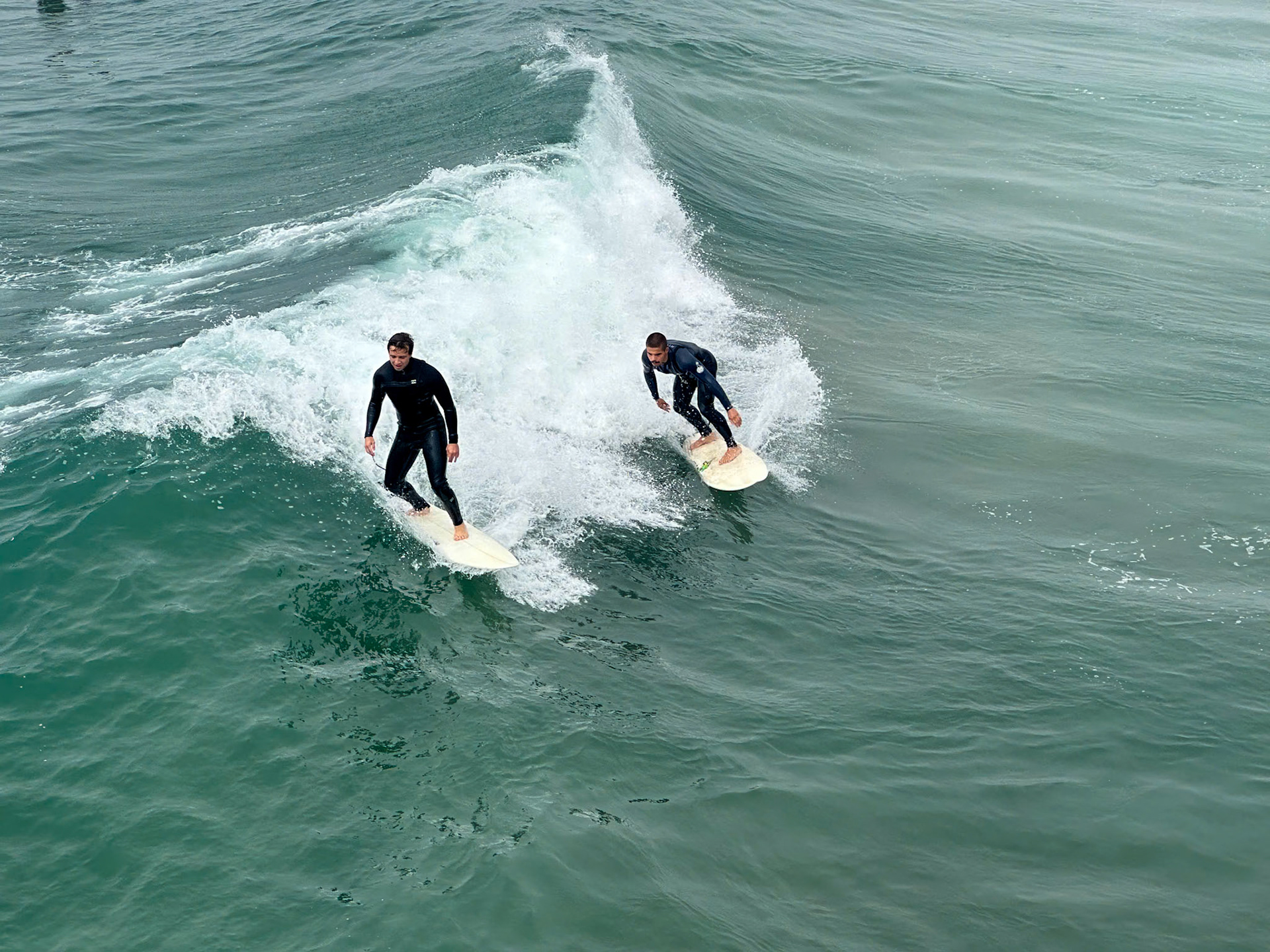 Surfers near the pier