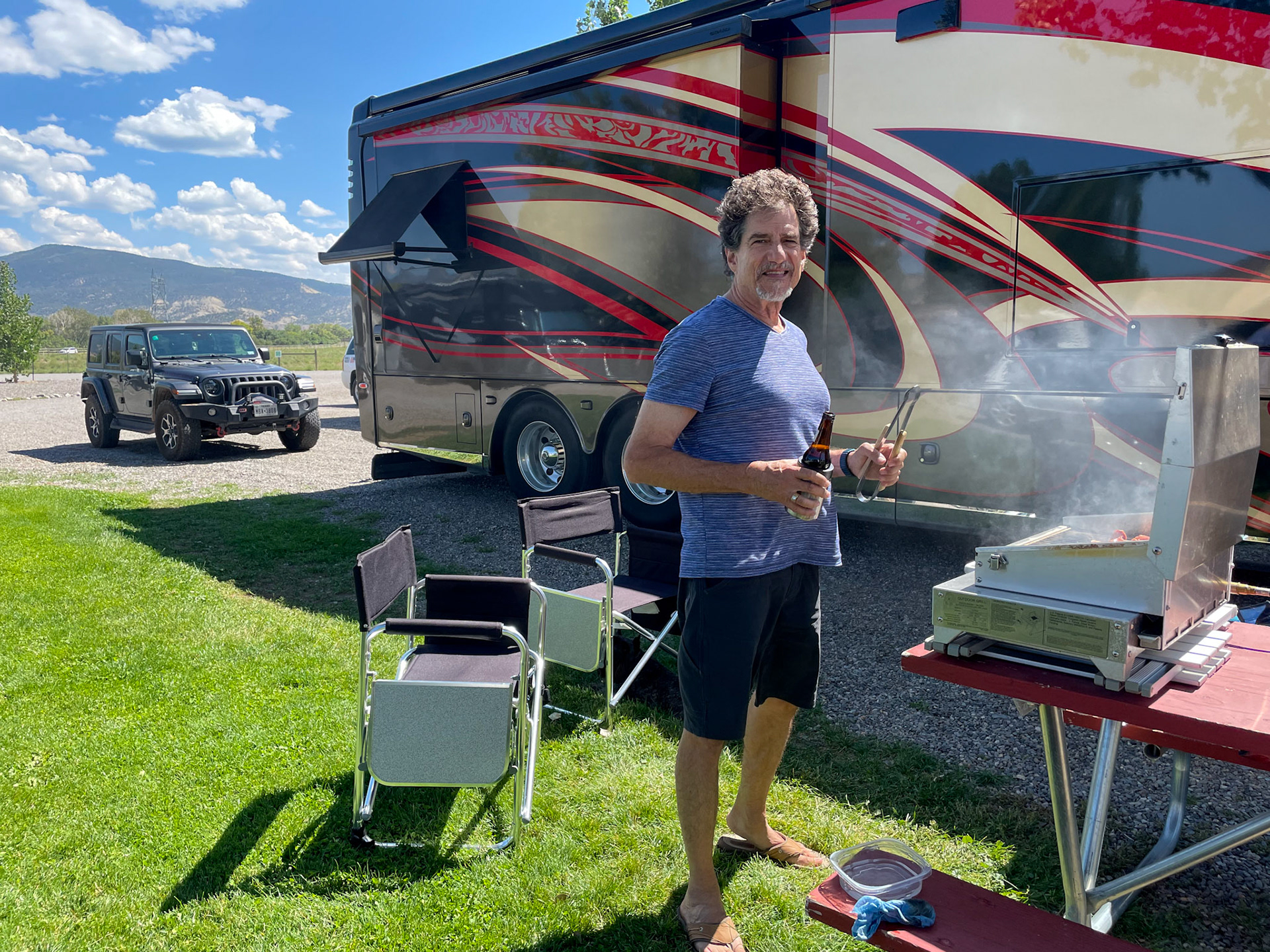 Yummy sausages smoking on the grill