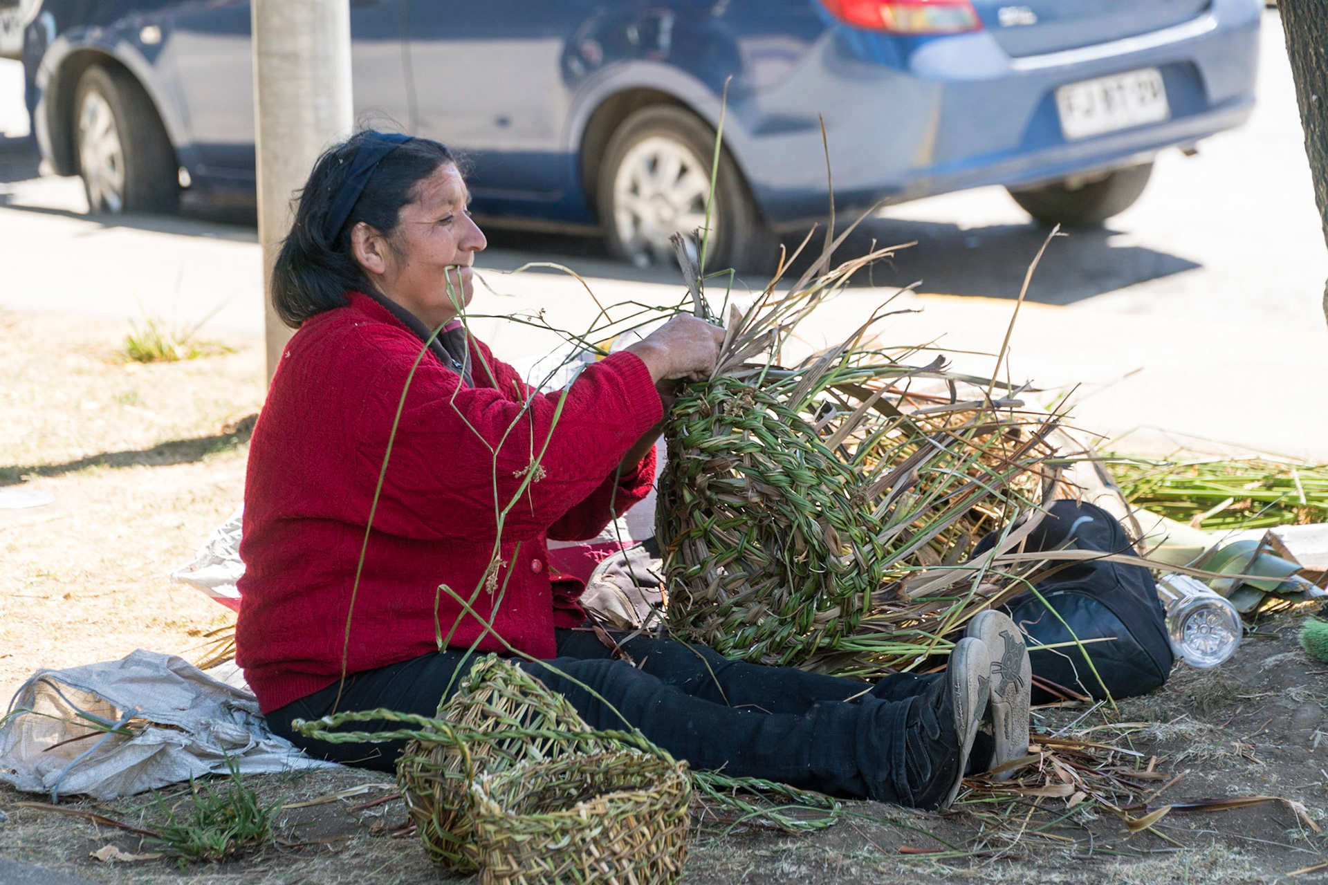 Basket weaver at Plaza de Armas in Castro
