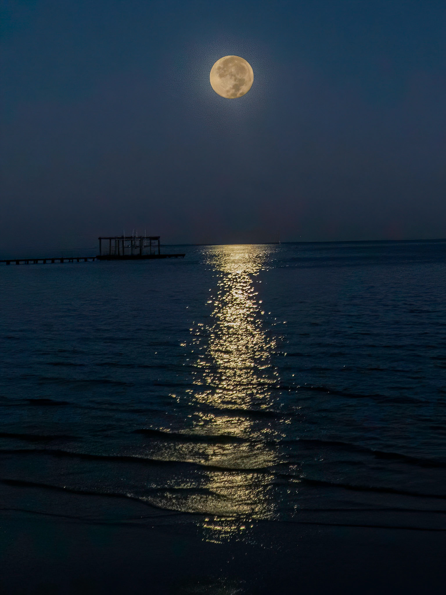 Full moon rising over Galveston Bay