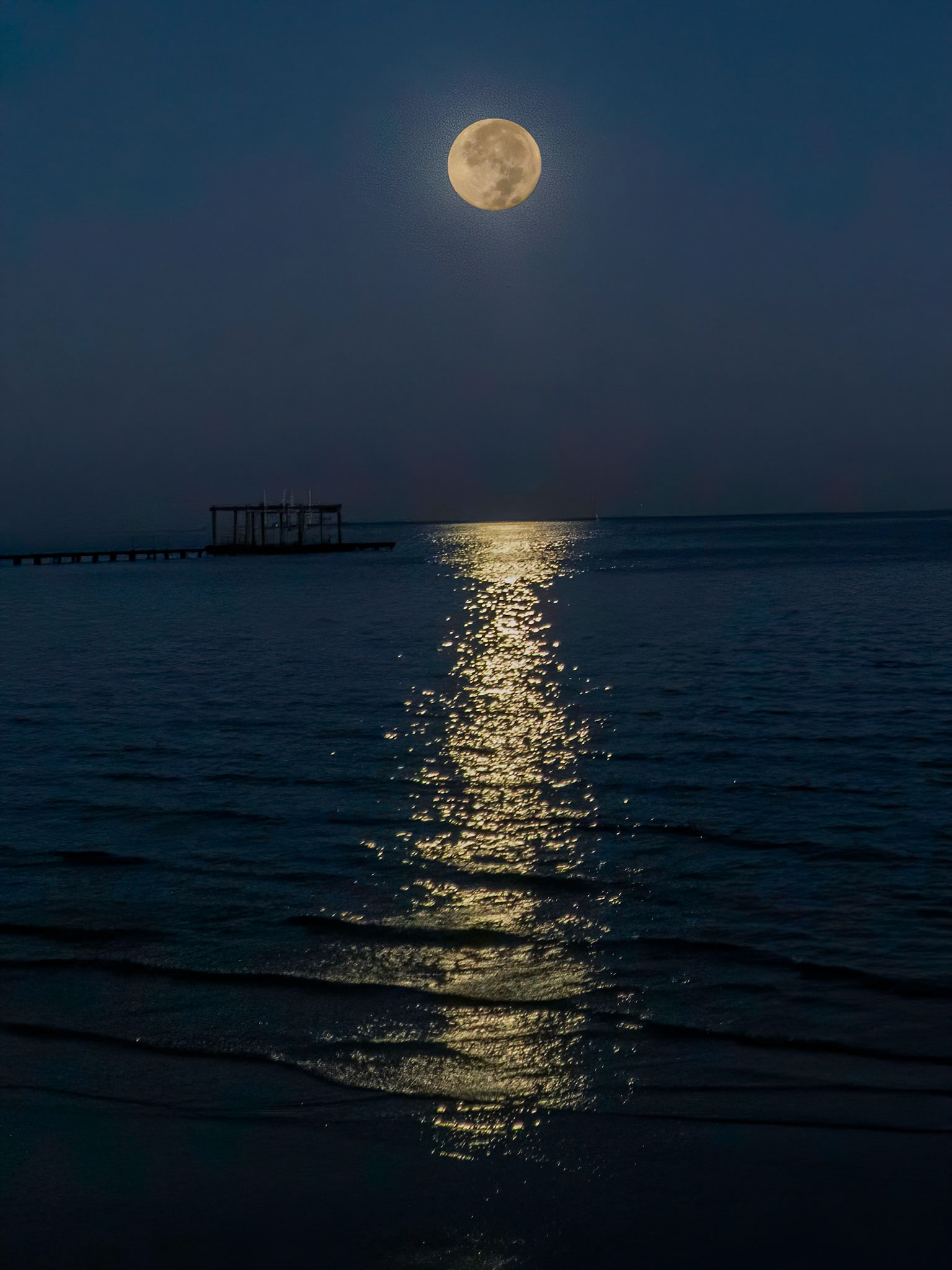 Full moon rising over Galveston Bay