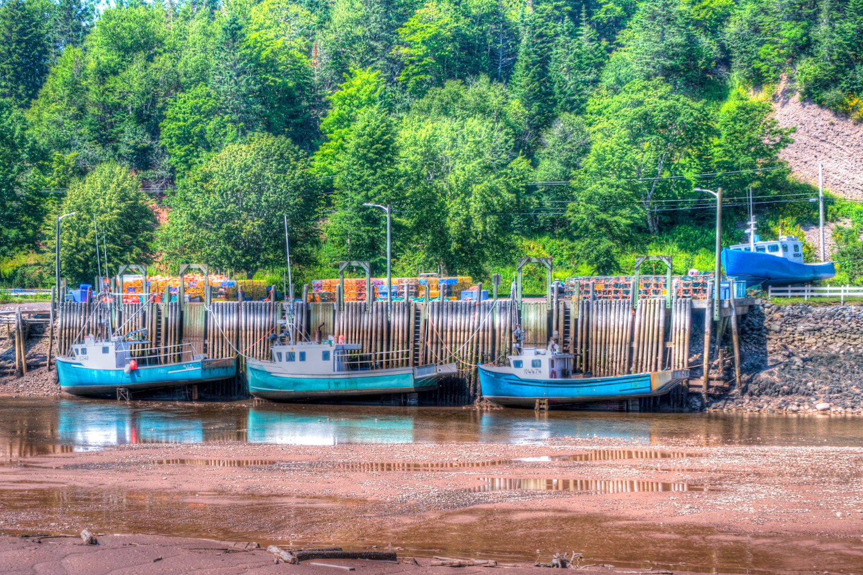 Boats at low tide in the harbour at St Martins