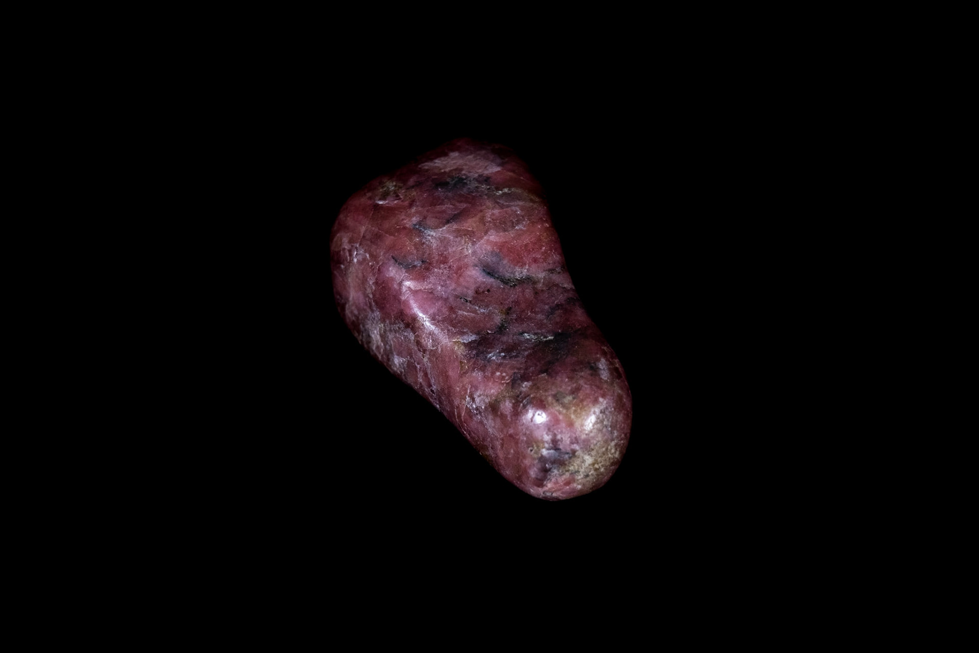 Pink Rhodonite Mineral on Black