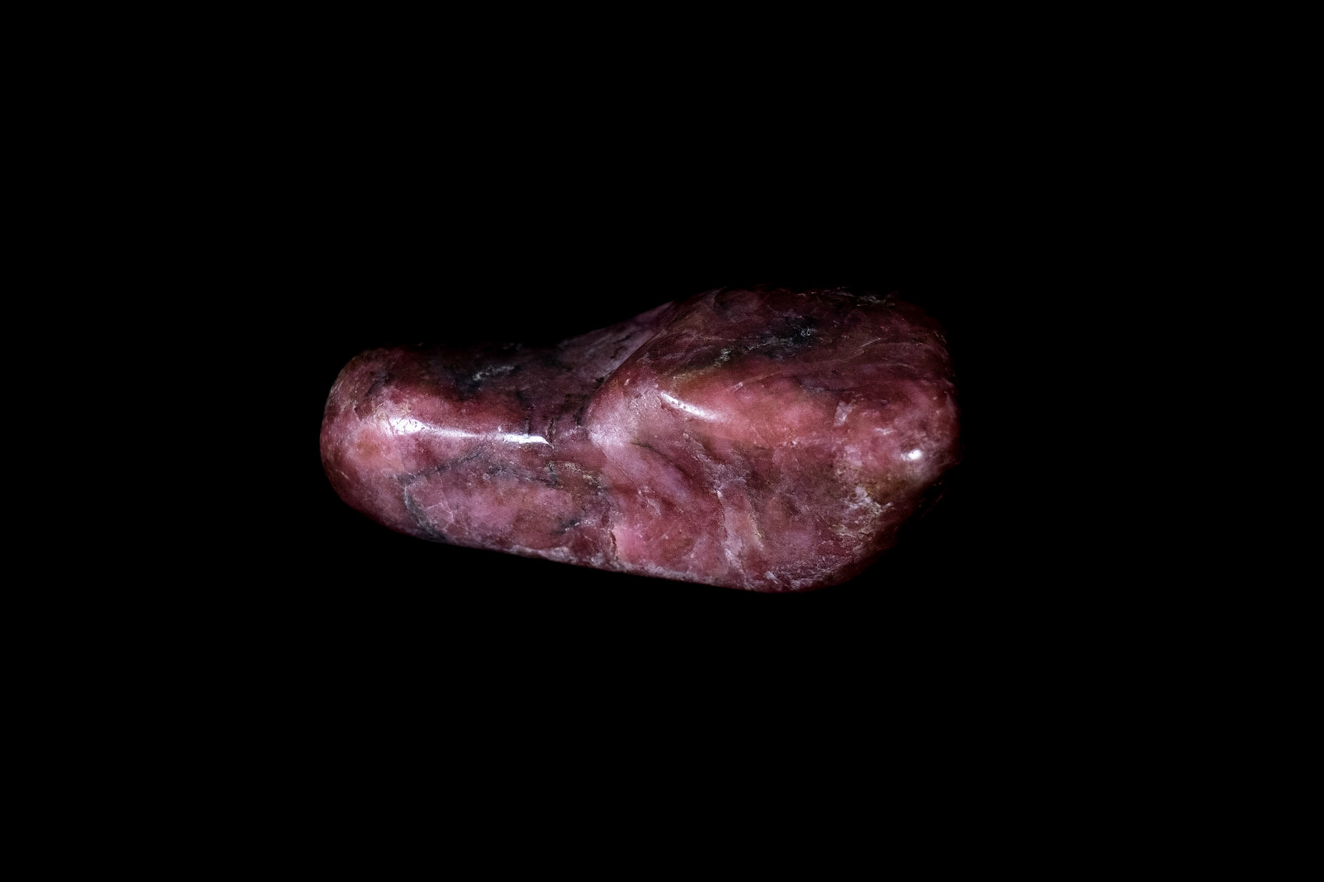 Pink Rhodonite Mineral on Black