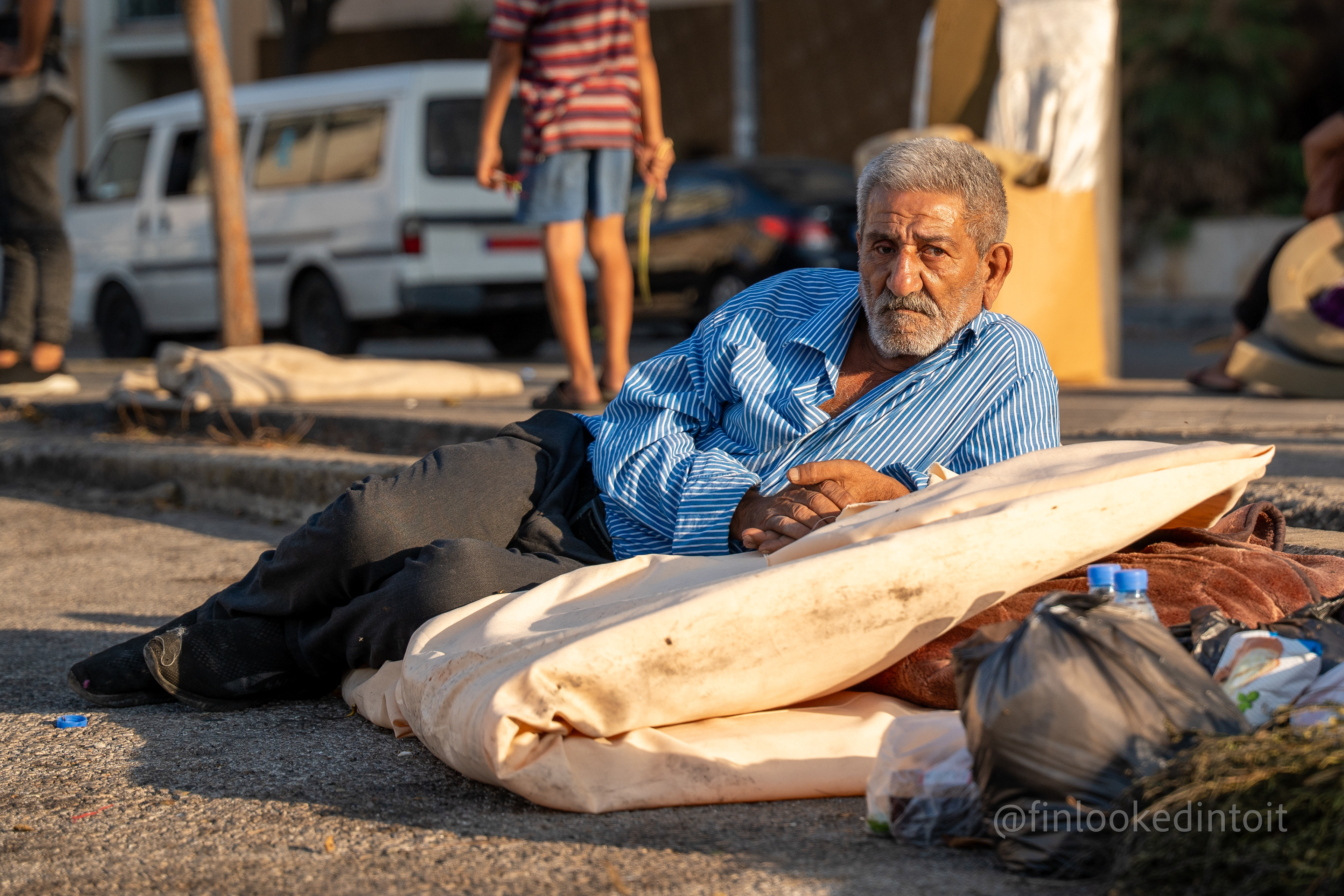 A Lebanese man sleeping on the streets of Beirut as Israeli airstrikes pound the nearby region of Dahieh, 10/10/2023