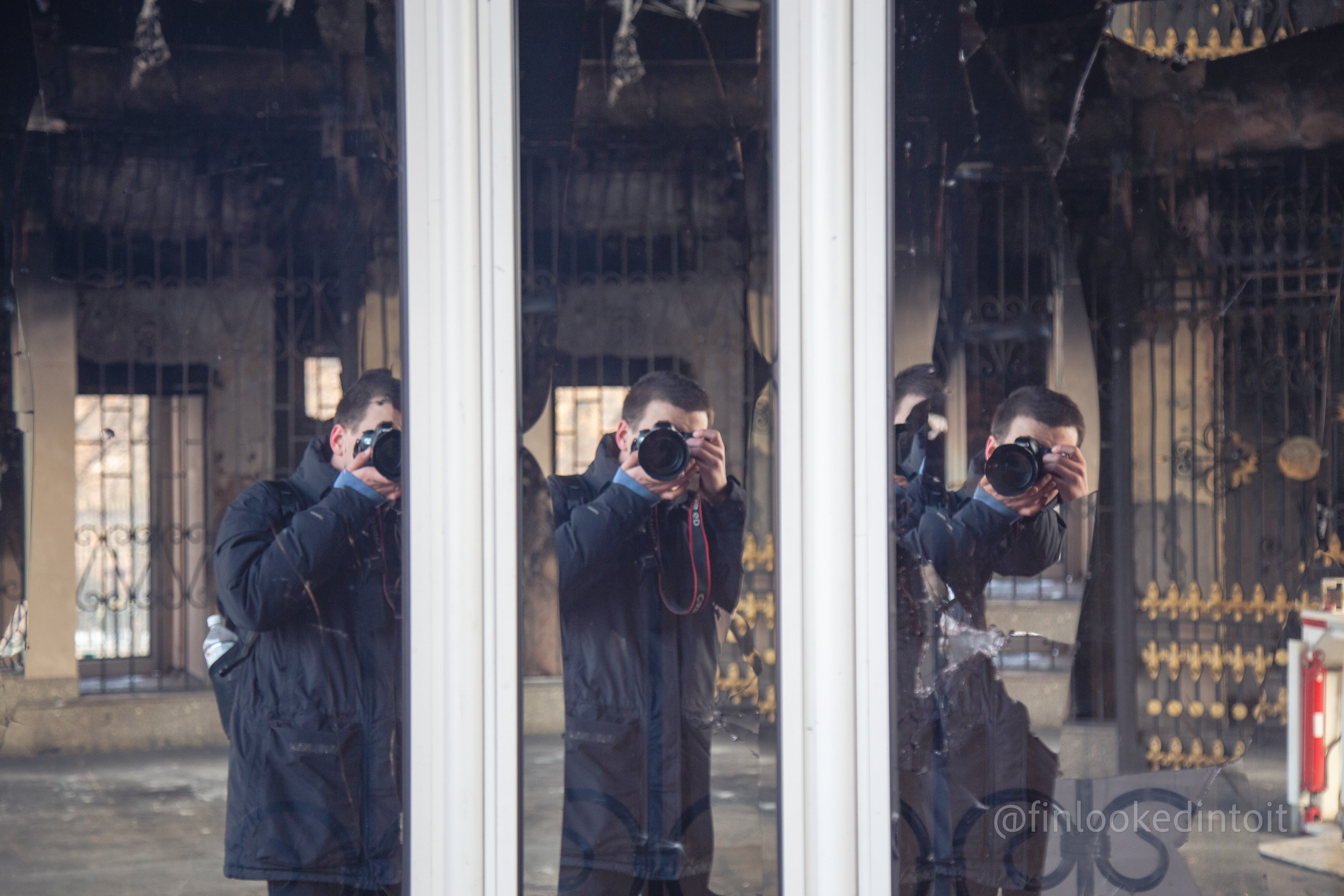 Using broken glass for a self-portrait at the city hall in Almaty, Kazakhstan, 01/31/2022