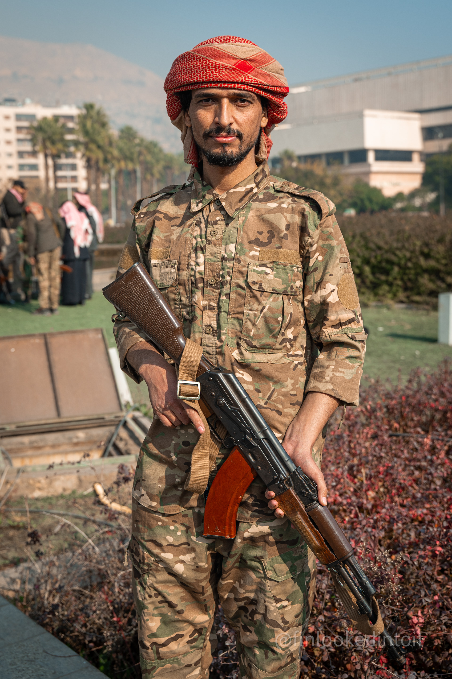 A militant from Hay'at Tahrir al-Sham poses for a photo in Damascus, Syria, 12/9/2024