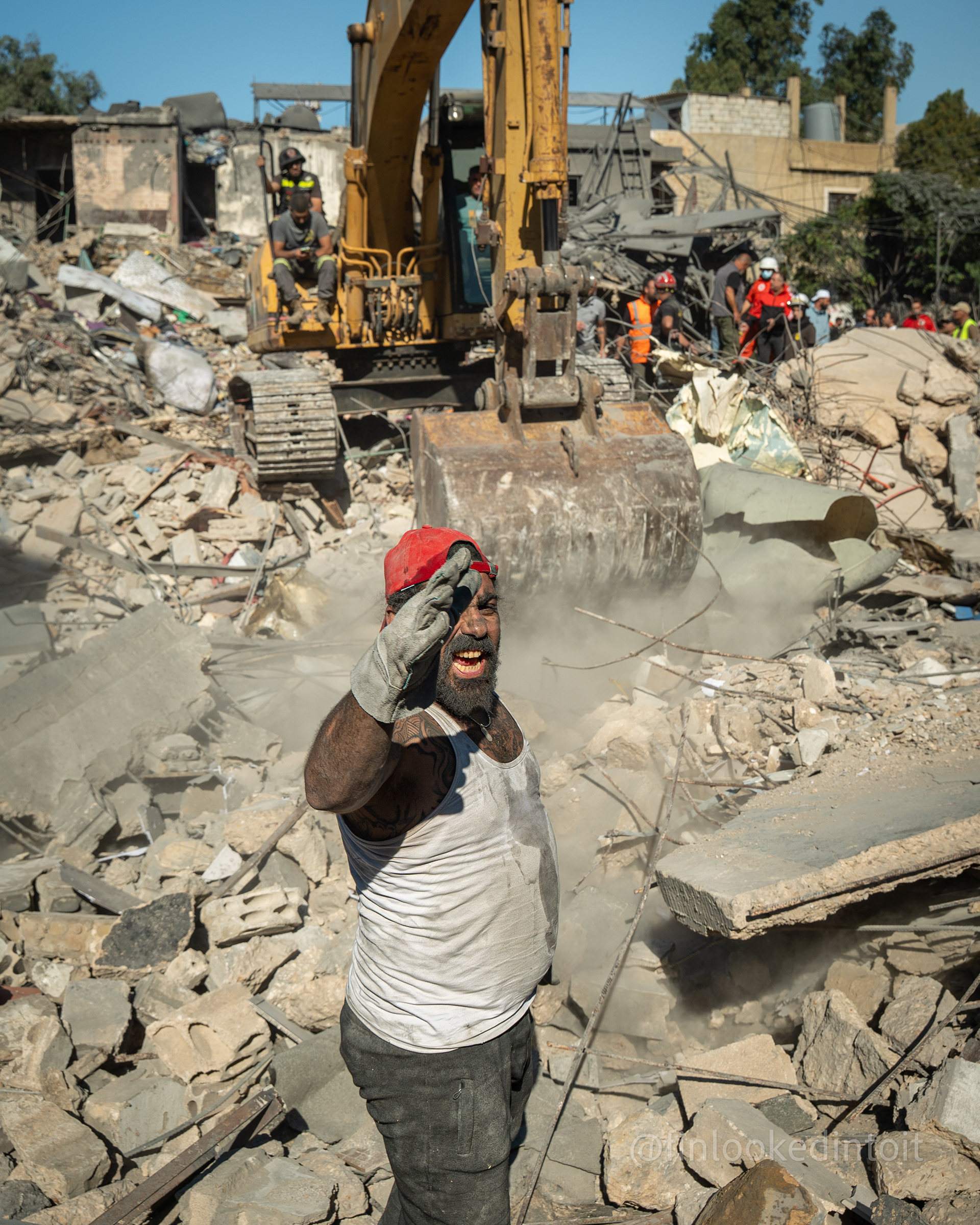 Lebanese rescue workers sift through the rubble for survivors after an Israeli airstrike in the Jnah neighbourhood, Beirut, 10/15/2023