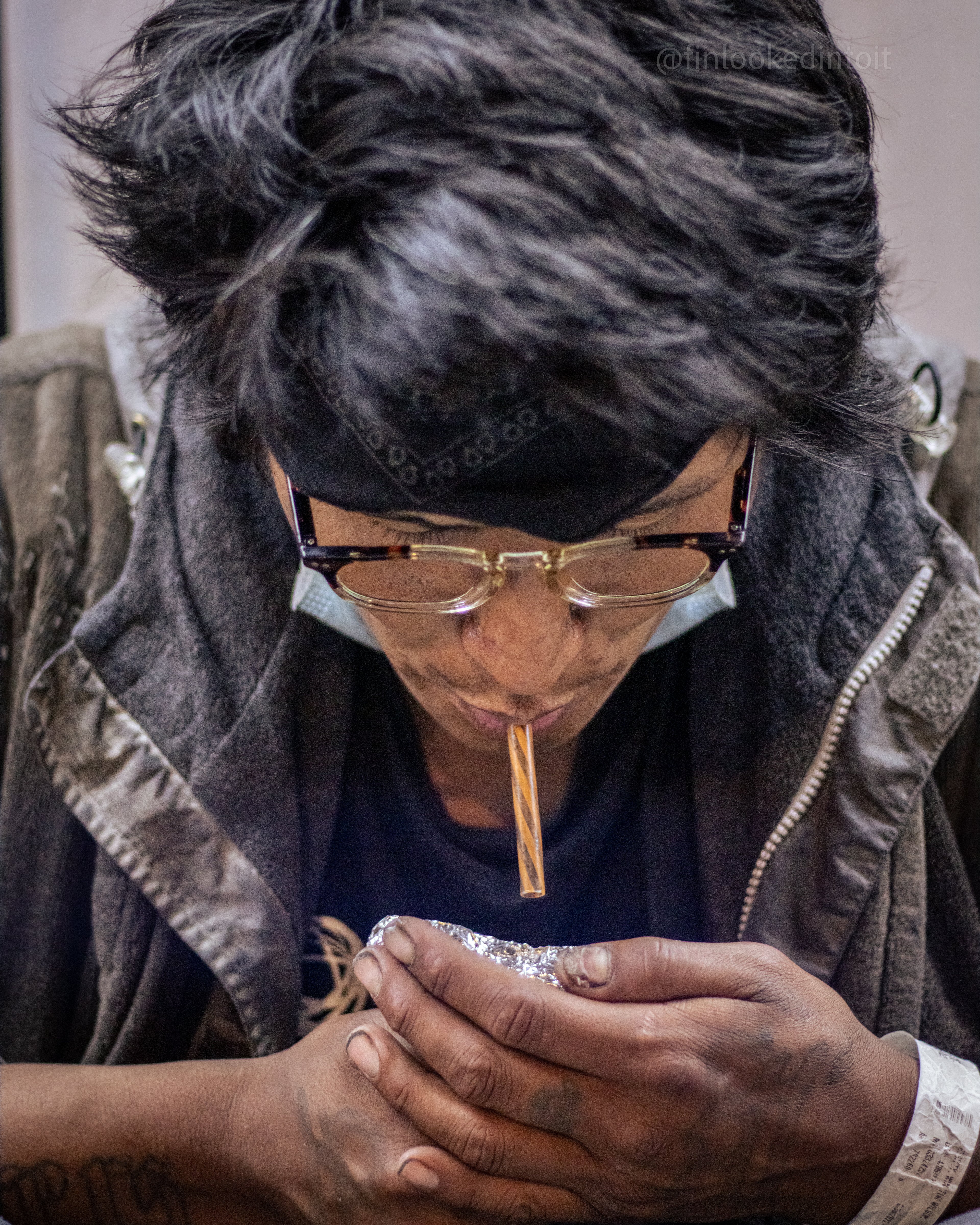 A man smokes fentanyl on the streets of San Francisco, California, 05/25/2022