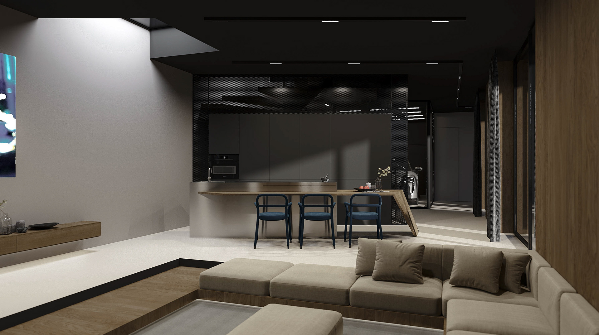 Interior view of a modern living space with a minimalist design, featuring a sunken seating area, a kitchen with an island, and dark color schemes