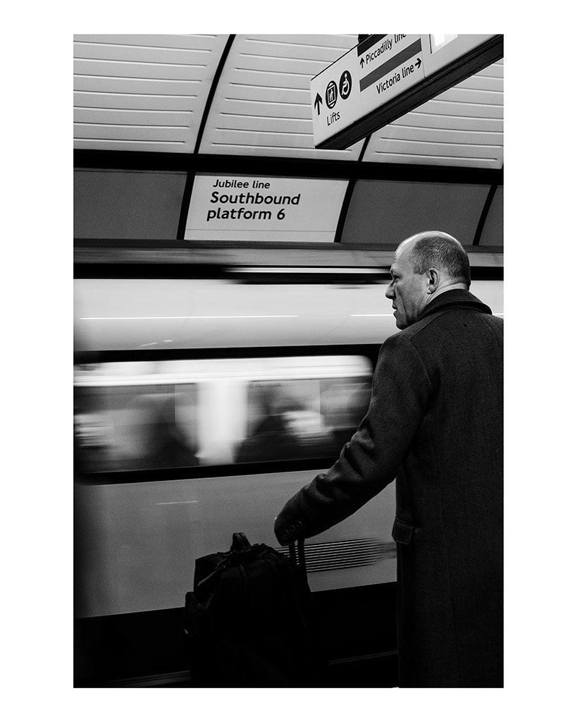 Isolation in London Transport; The City That Never Speaks. 2/5 A man stands alone, looking down the platform, as his train to work slows down in the London Underground, England, November 26, 2018. 